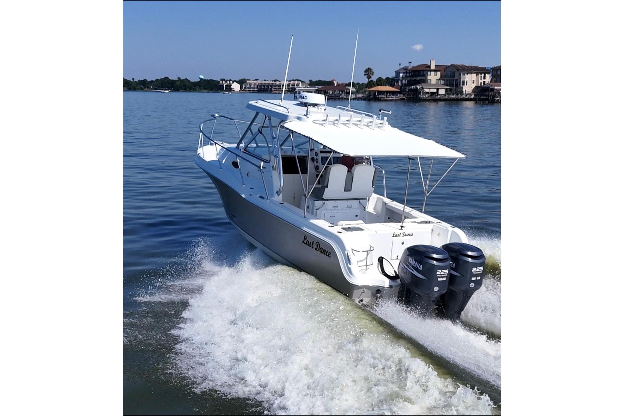 2007 Polar 2700 Walkaround boat cruising on a calm lake with twin Yamaha engines.