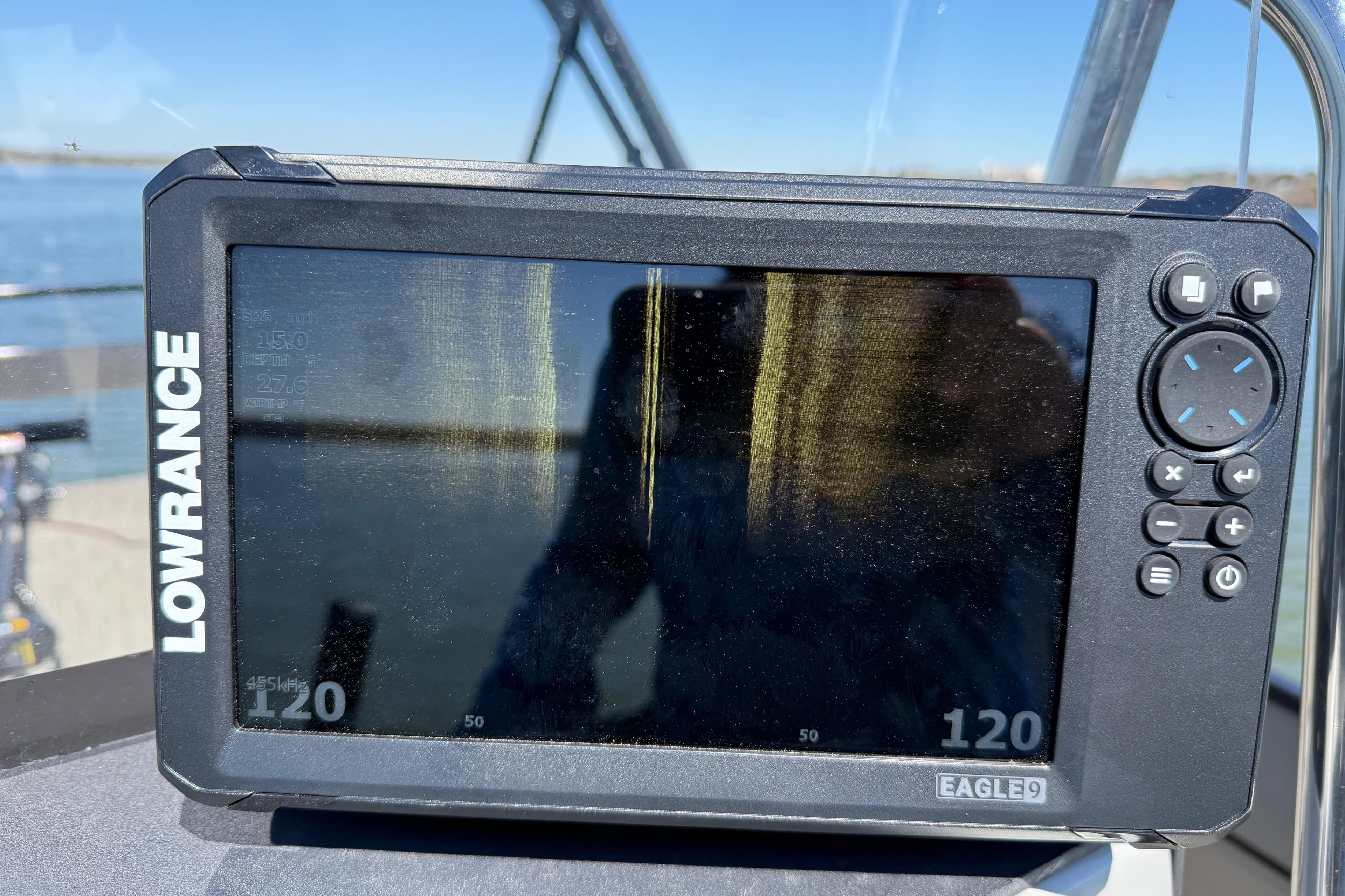Lowrance Eagle9 fish finder on Misty Harbor 210 RF, 2018 model, with water background.
