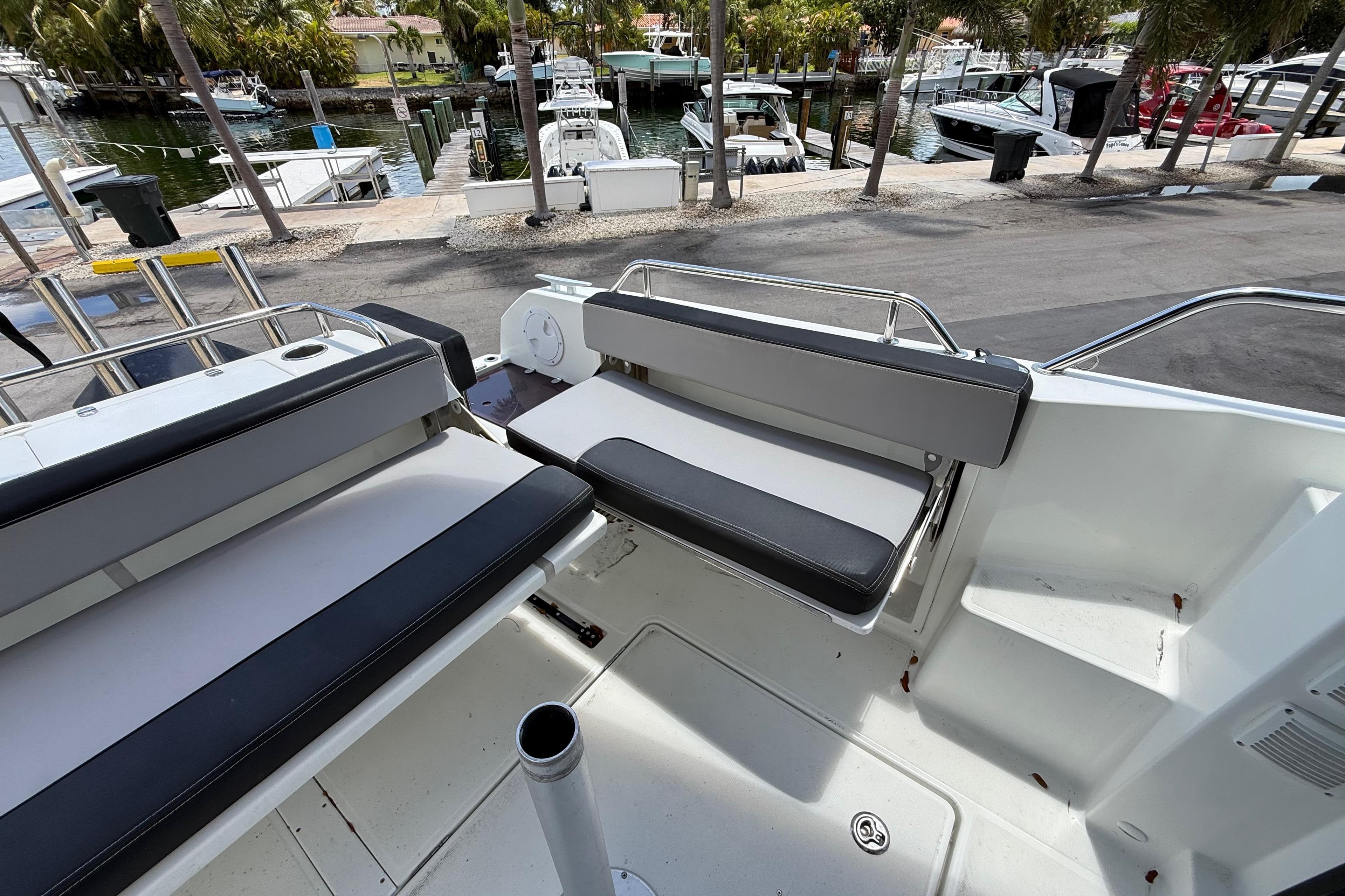 2021 Jeanneau NC 895 boat interior with seating, docked at marina.