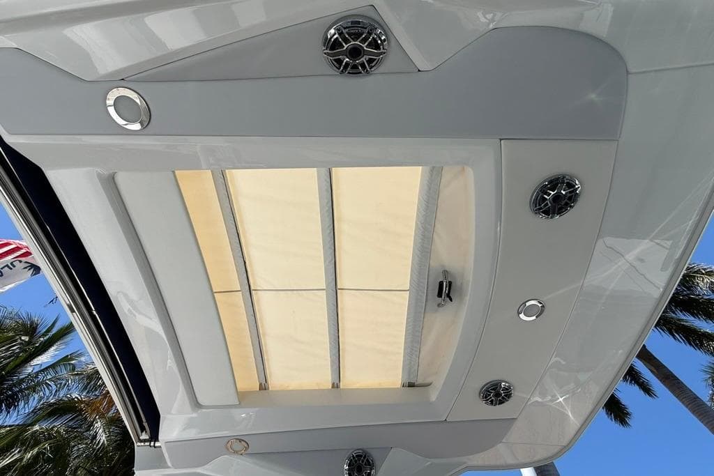2025 Formula 330 Crossover Bowrider OB boat roof with speakers and sunroof.