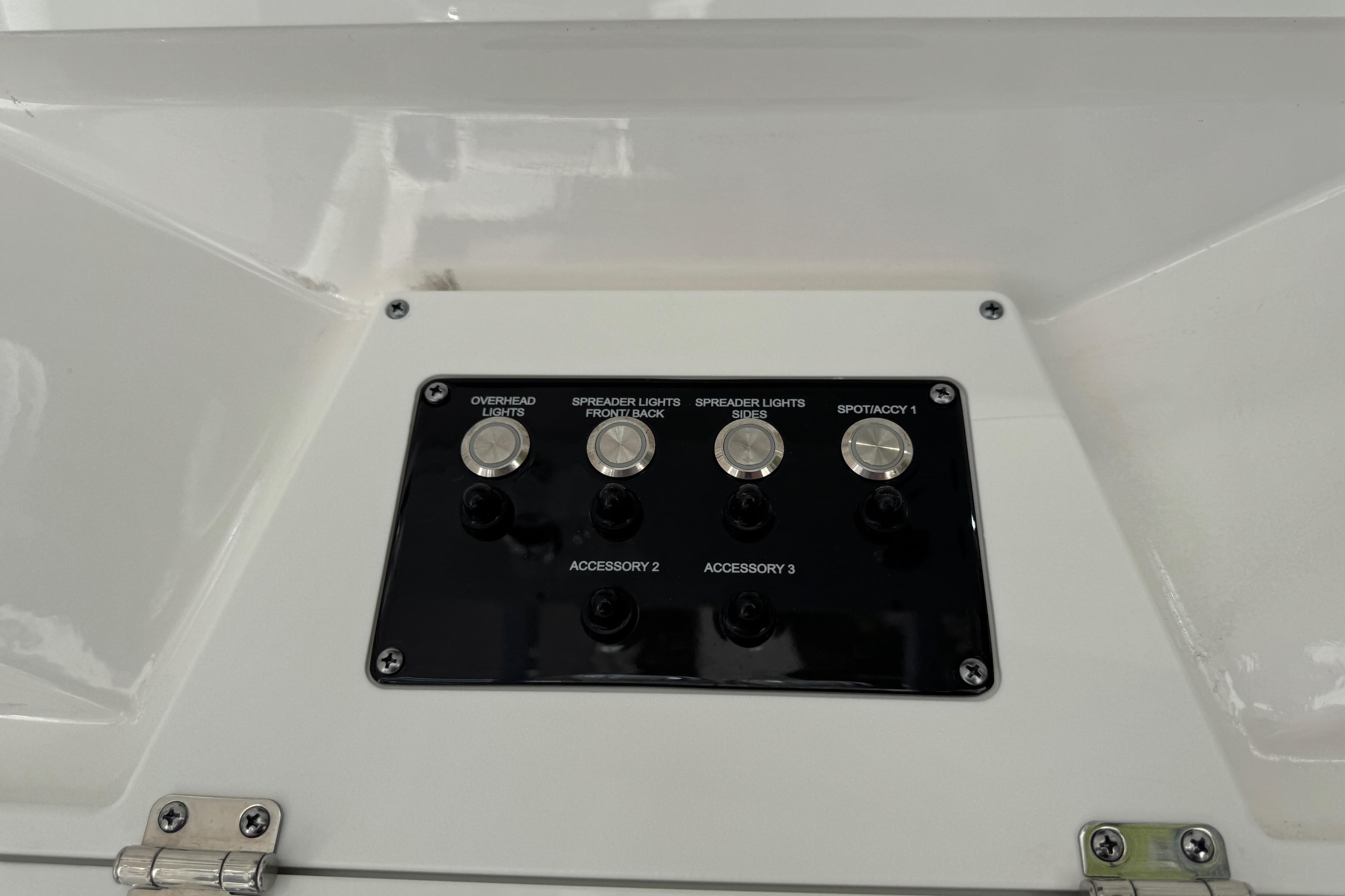 Control panel on 2025 Sea Fox 288 Commander boat with labeled switches.