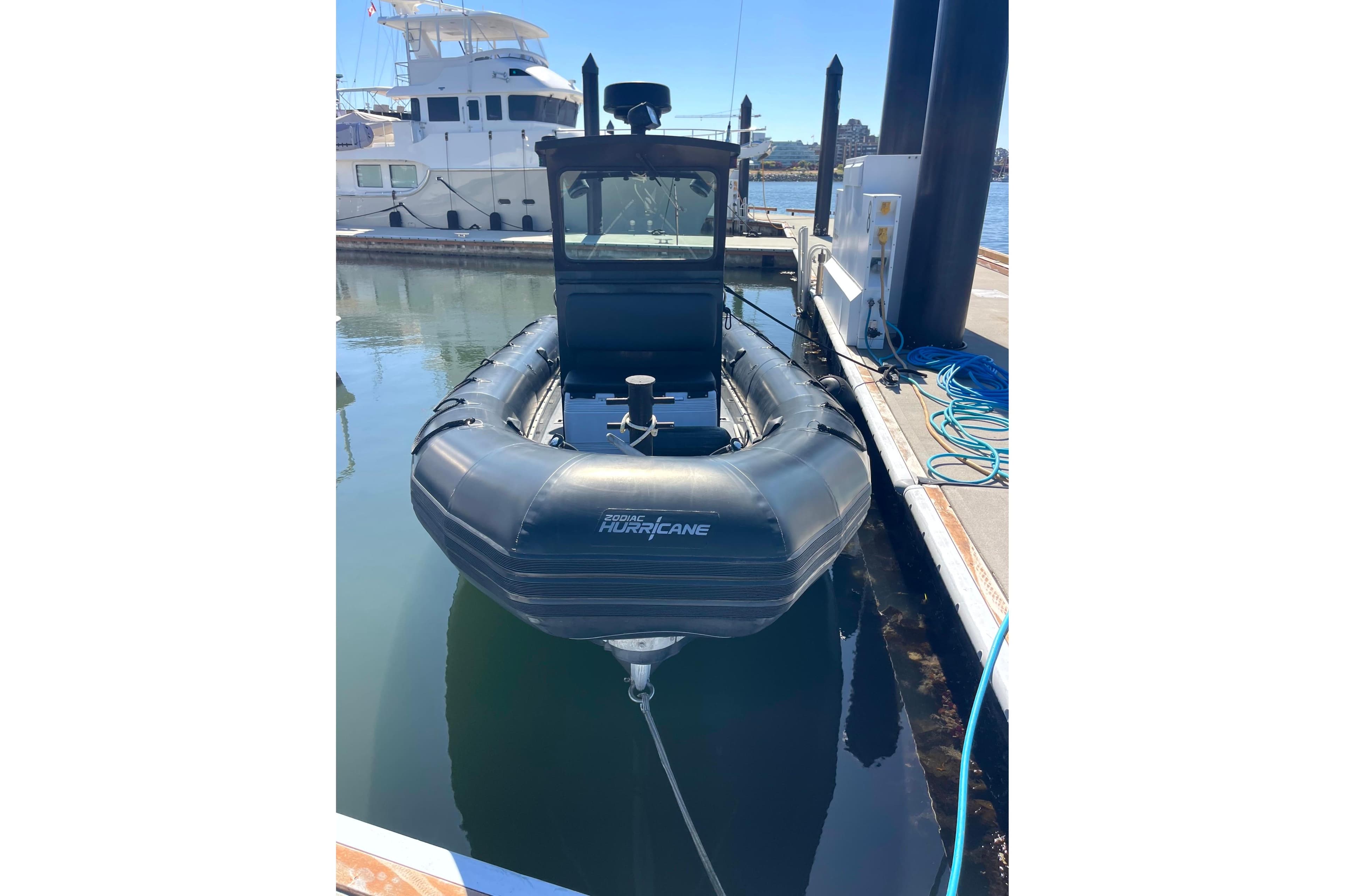Zodiac Hurricane 733 boat docked at marina, 2000 model, front view.