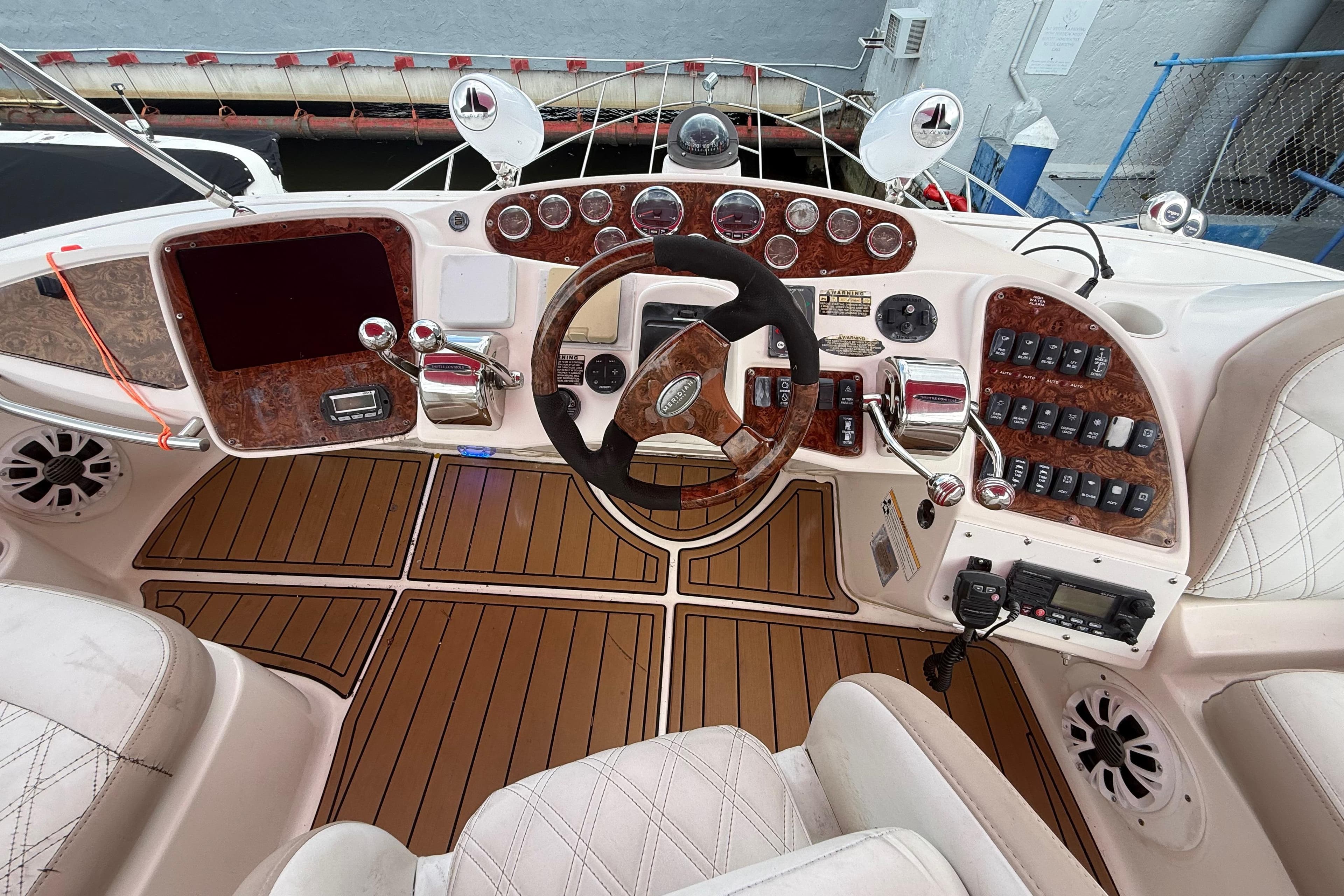 Cockpit of 2007 Meridian 459 Motoryacht with wood accents and modern controls.