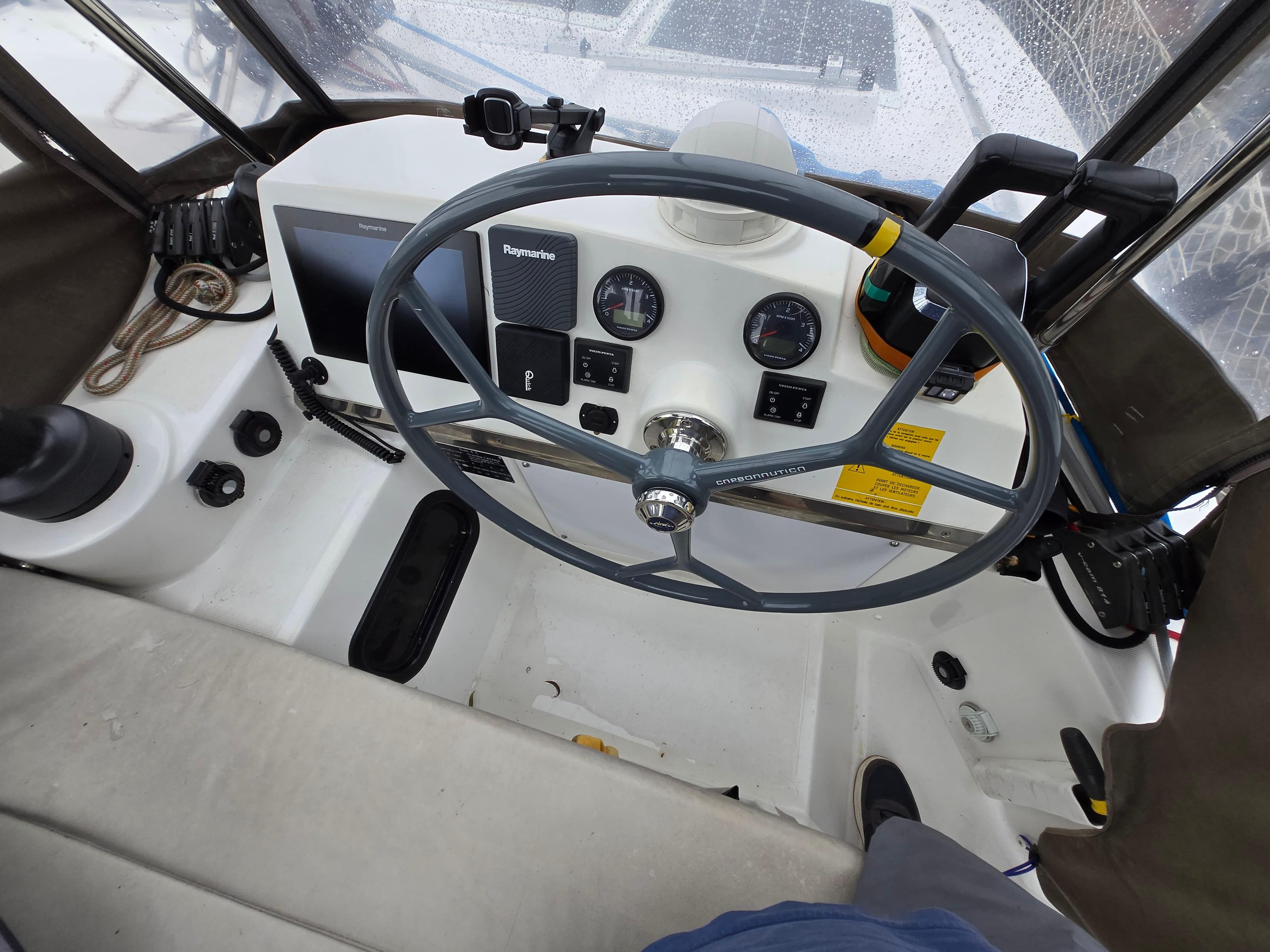 Steering wheel and controls of a 2018 Bali 4.1 Catamaran cockpit.