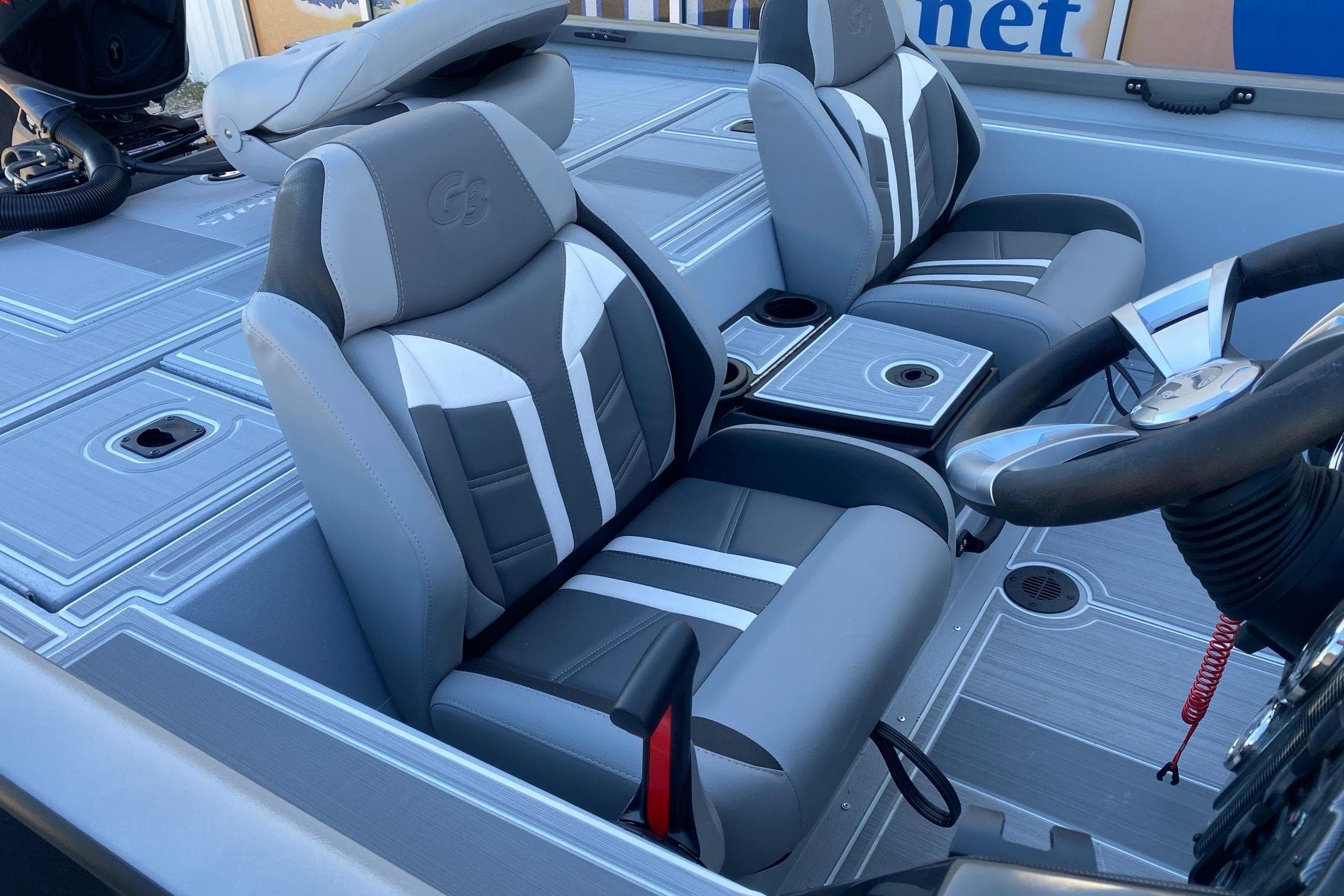 2026 G3 Sportsman 1810 SE boat interior with sleek, modern seating and steering wheel.