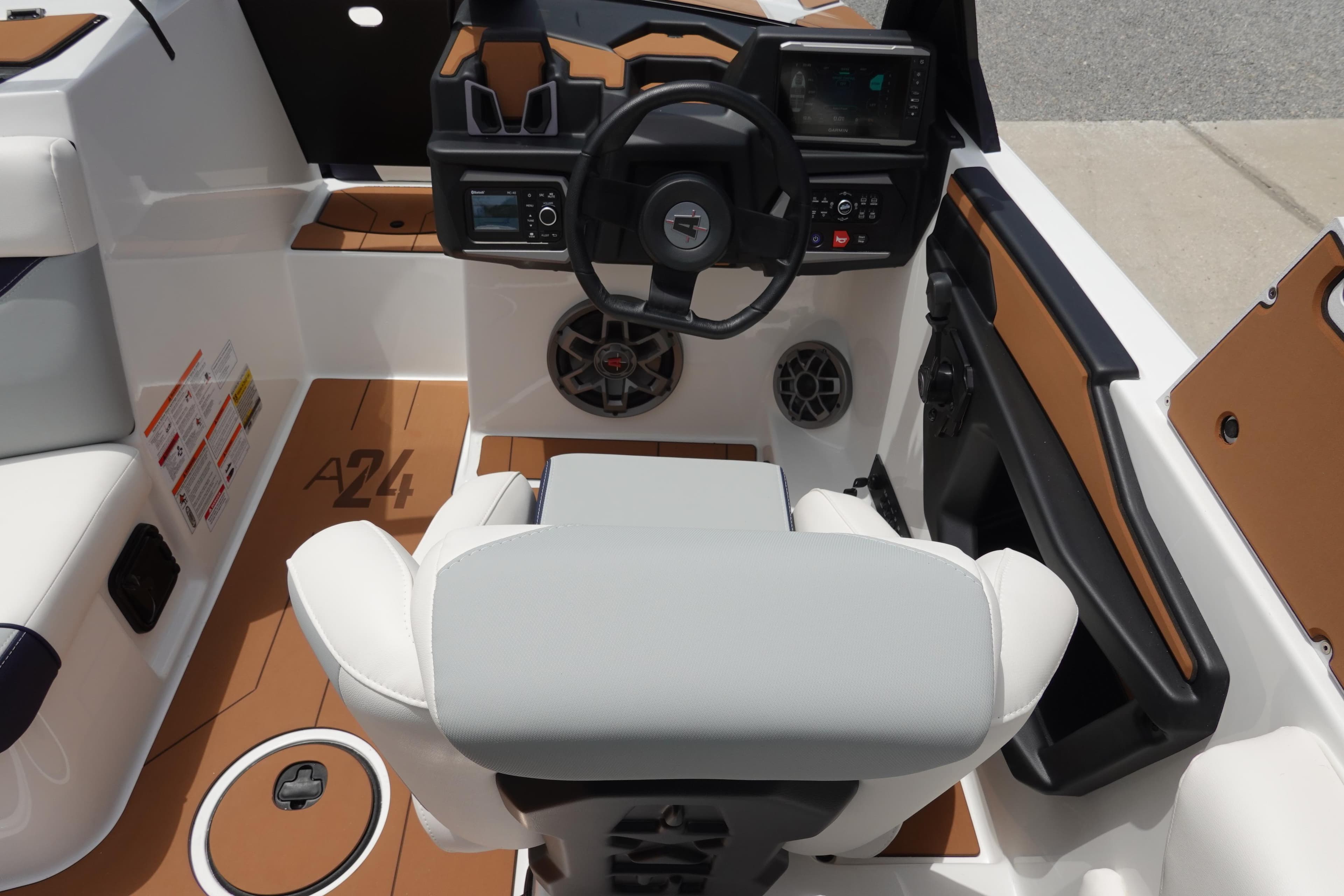 2023 Axis A24 boat interior with steering wheel and dashboard controls.