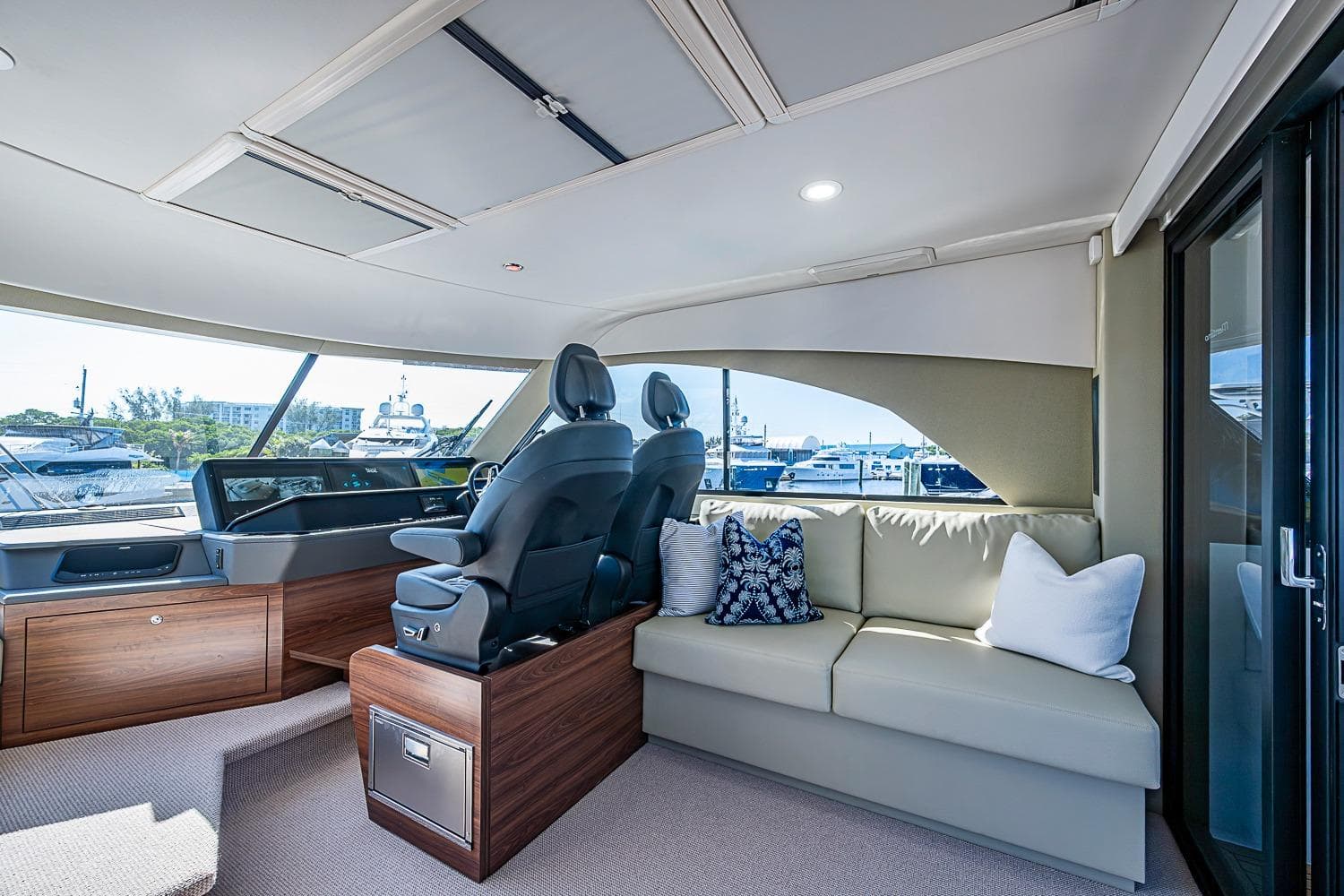 Luxurious interior of 2026 Maritimo M50 yacht with plush seating and modern helm.