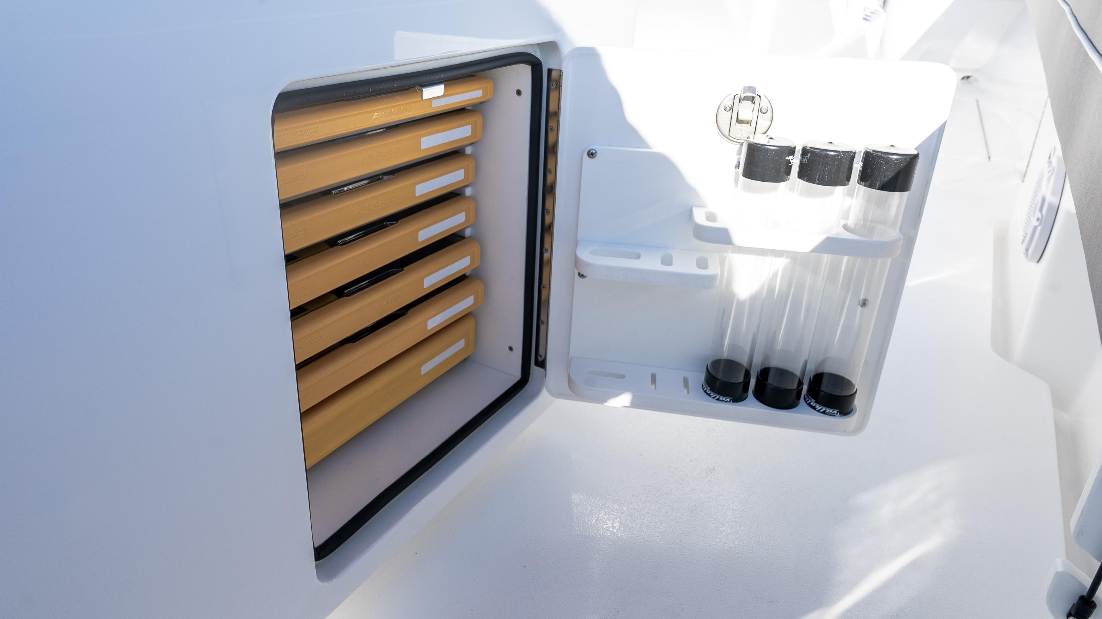 2025 Valhalla Boatworks V-37 storage compartment with organized shelves and containers.