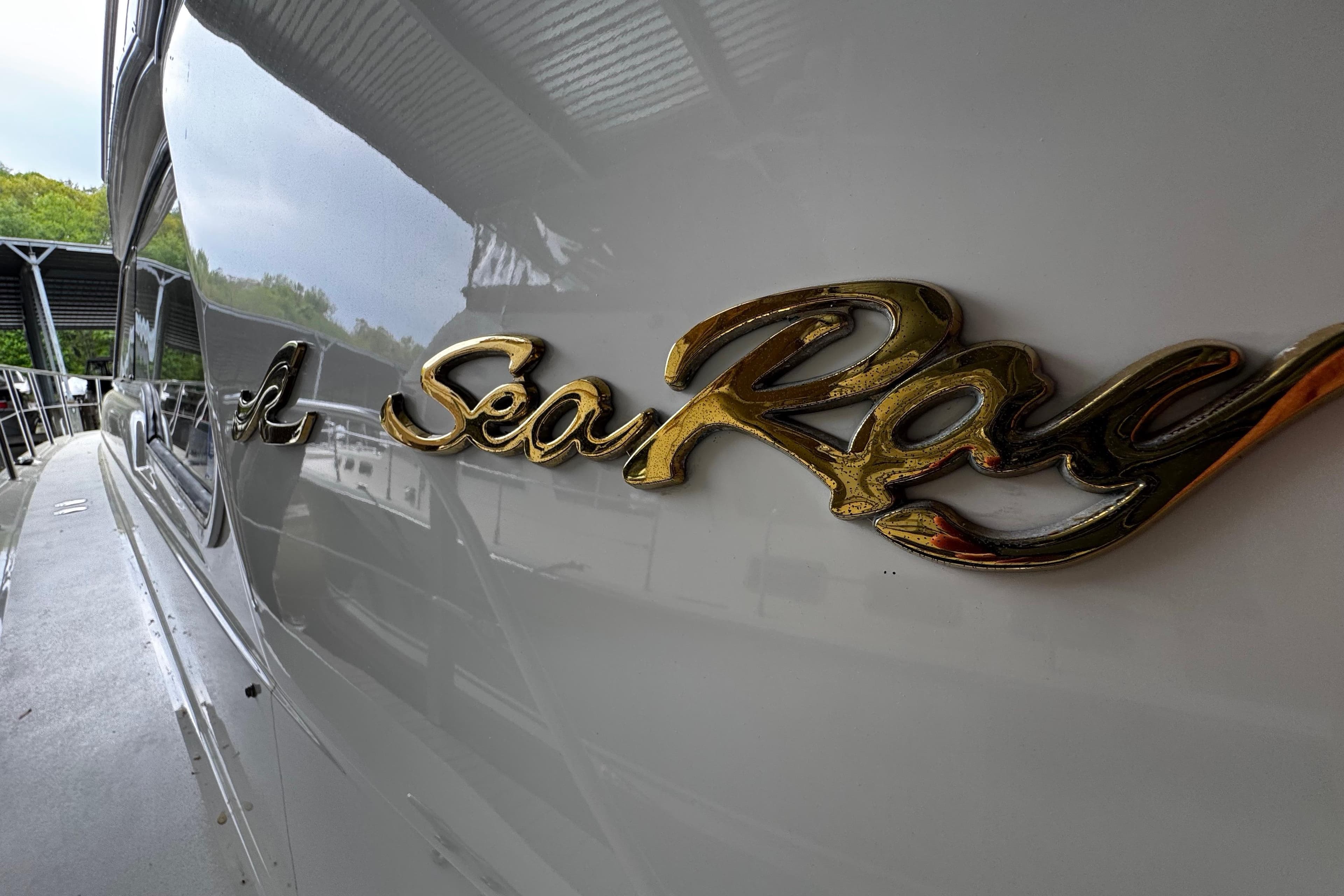Close-up of 1999 Sea Ray 480 Sedan Bridge yacht logo.