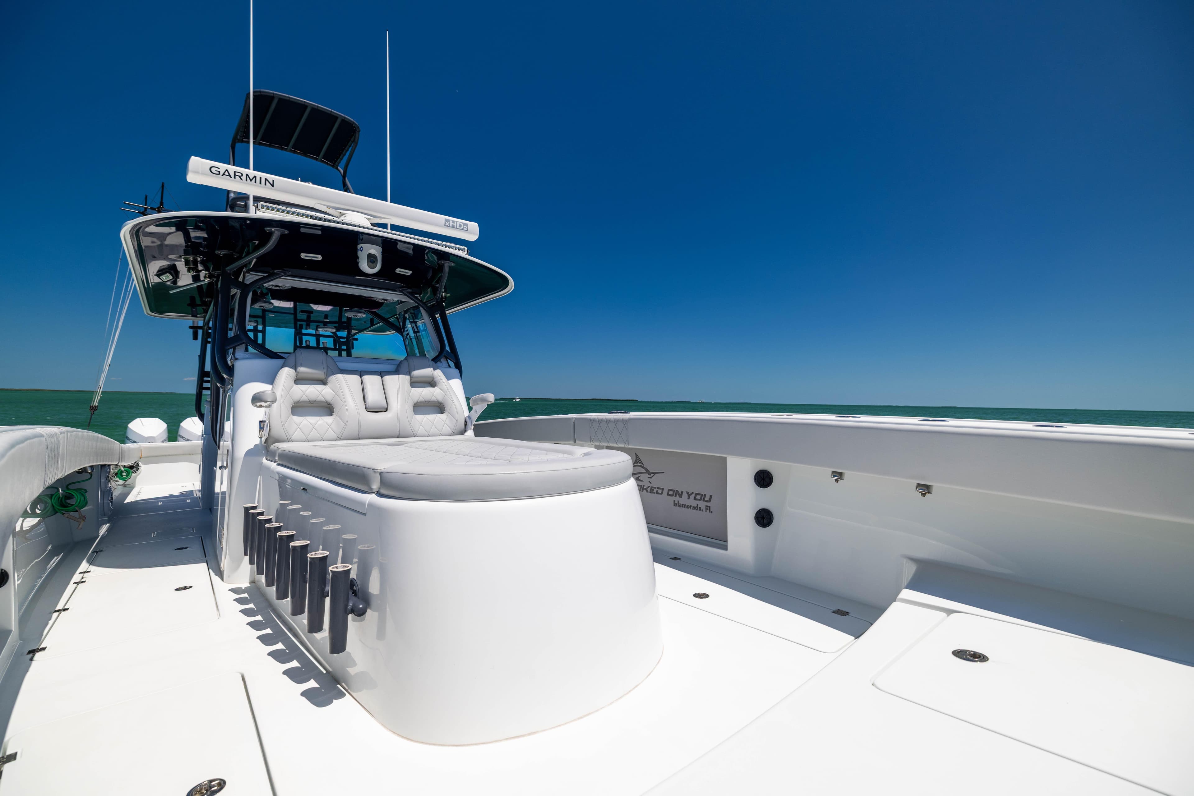 2021 Freeman 42 LR boat with sleek design, spacious deck, and modern amenities under clear blue sky.