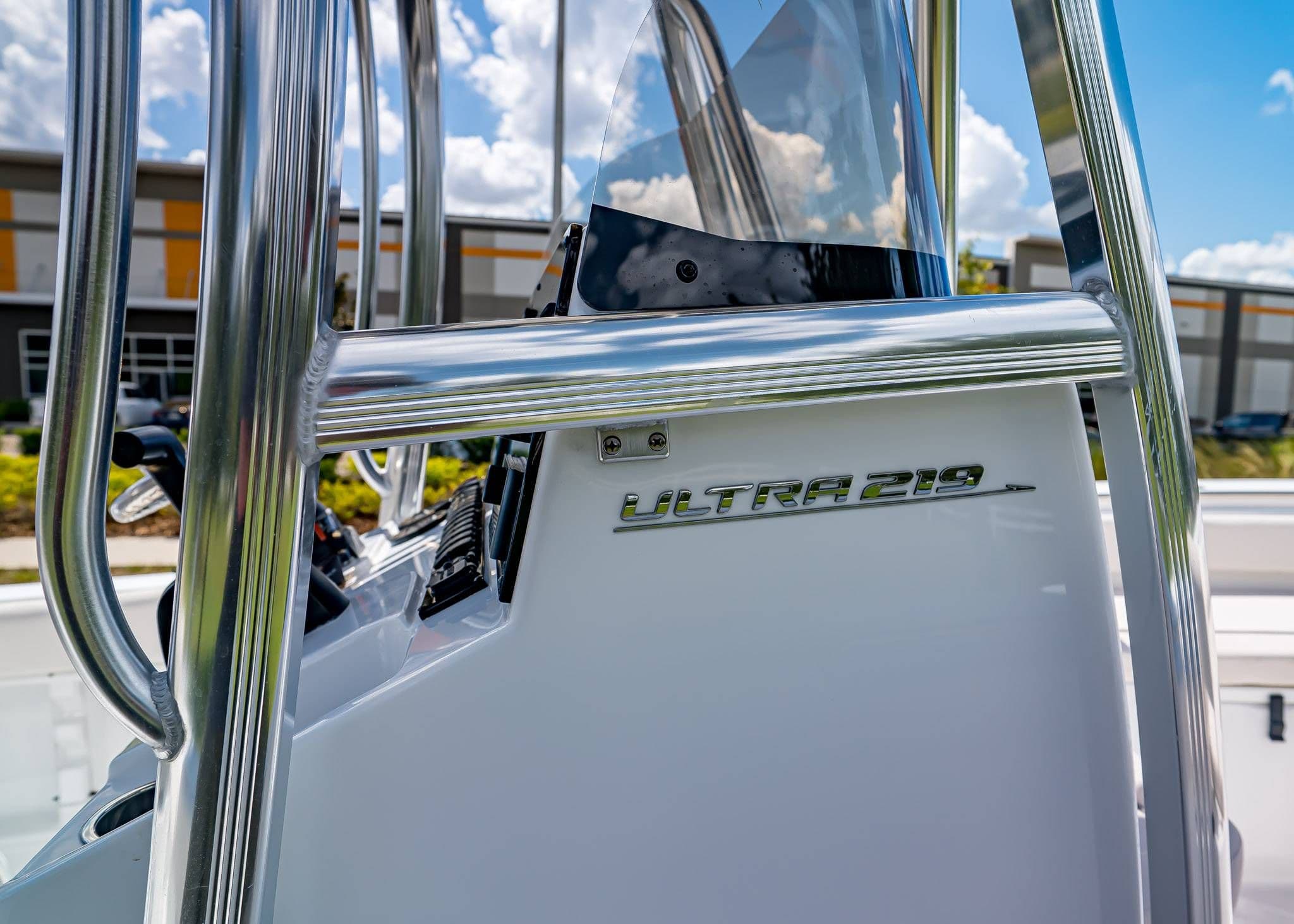 2026 Sea Hunt Ultra 219 boat console with chrome details and clear windshield.