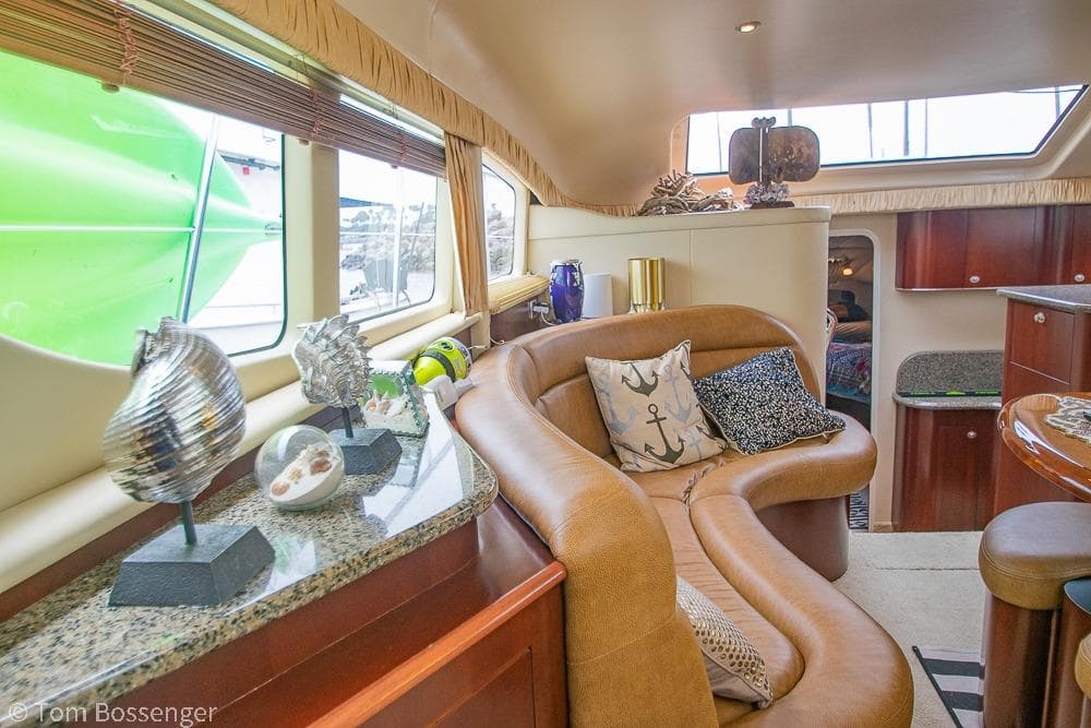 Luxurious interior of 2005 Sea Ray 390 Motor Yacht with elegant decor and comfortable seating.
