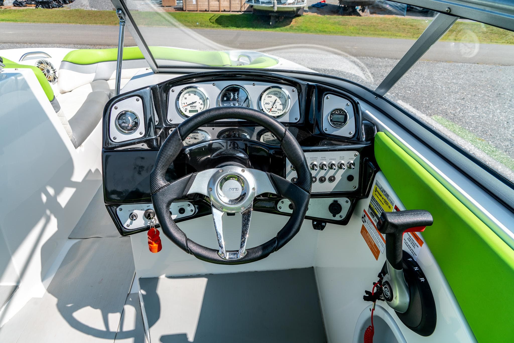 2014 Rinker Captiva 200 MTX boat dashboard with steering wheel and instrument panel.