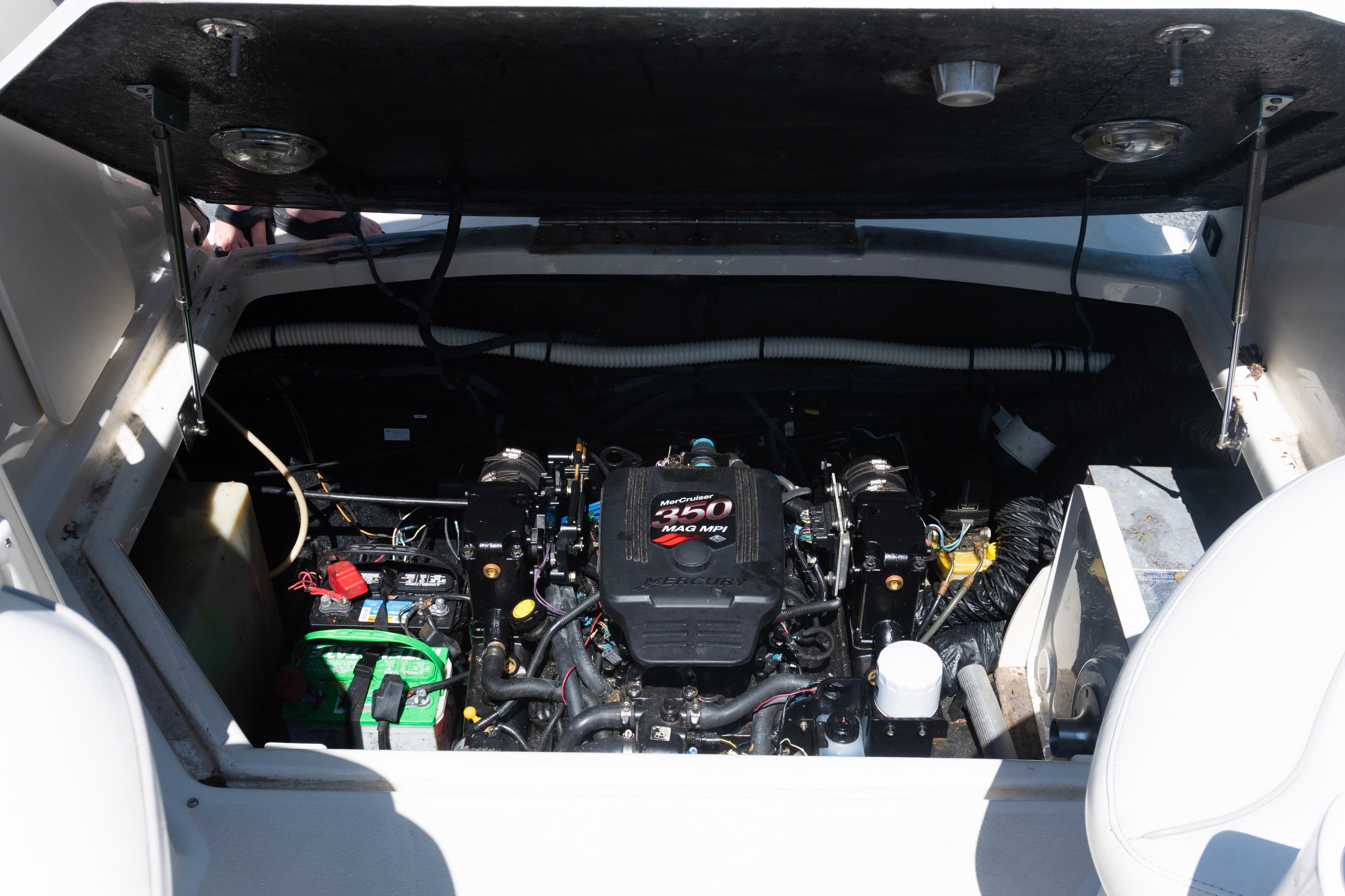 Engine compartment of a 2007 Stingray 250 CS boat, featuring a MerCruiser 5.0 MPI engine.