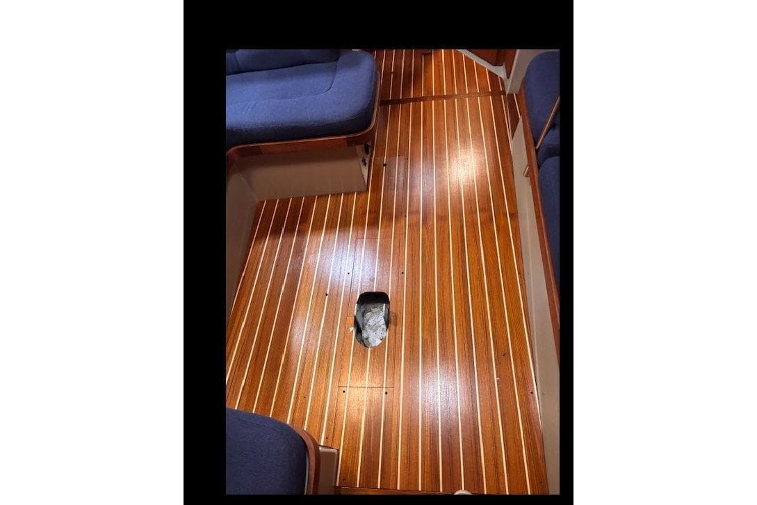 Interior of 1990 C&C 37/40 Plus sailboat with polished wooden flooring.