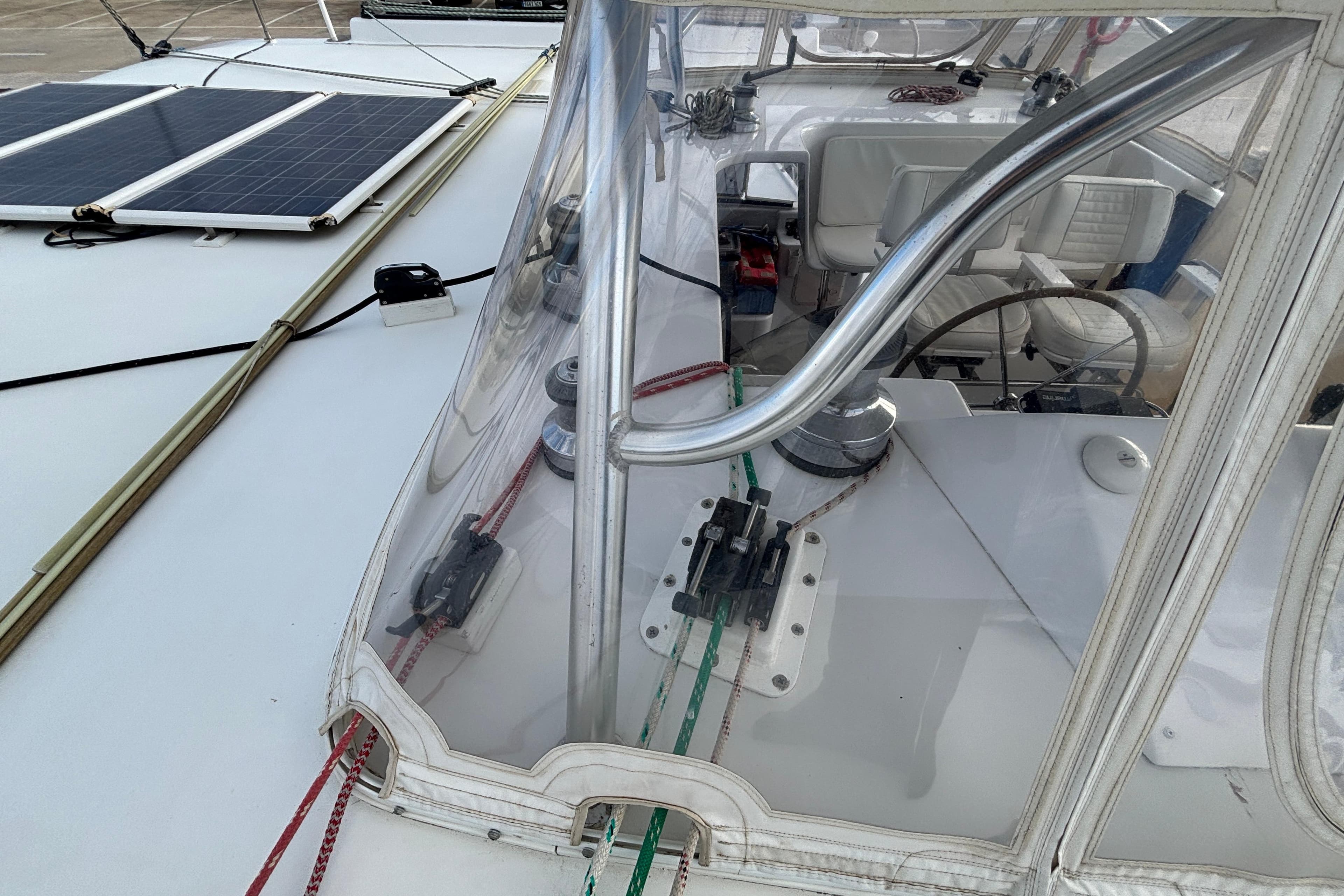 Cockpit view of 2009 Kelsall 58 KSS yacht with solar panels and steering wheel.