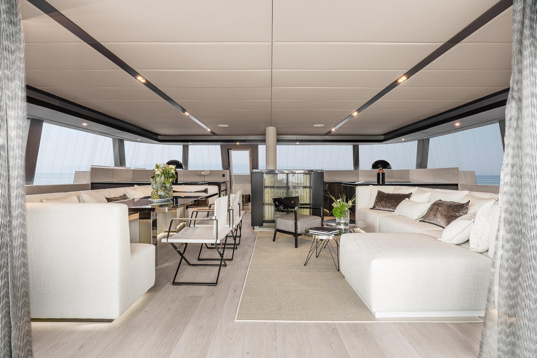Luxurious interior of 2026 Sunreef 70 yacht, featuring elegant seating and modern decor.