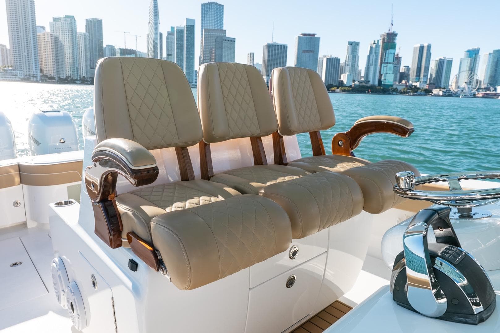 2022 Valhalla Boatworks V-37 luxury seating with city skyline backdrop.