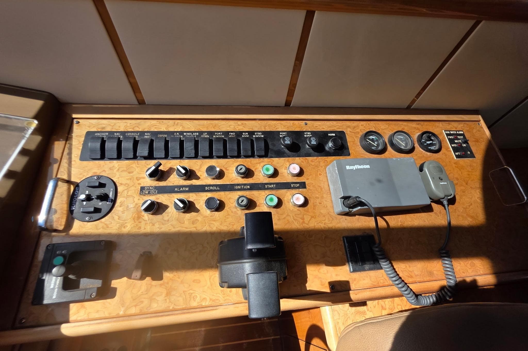 Control panel of a 2000 Neptunus 56 Express yacht with various switches and gauges.