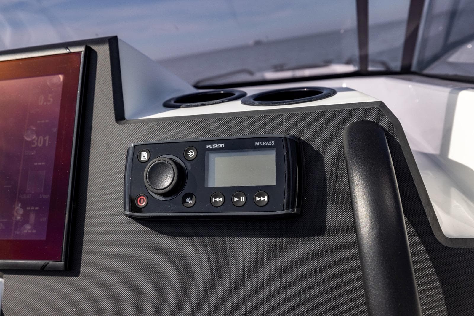 Control panel of Iron 707 boat, featuring a Fusion MS-RA55 stereo system, 2022 model.