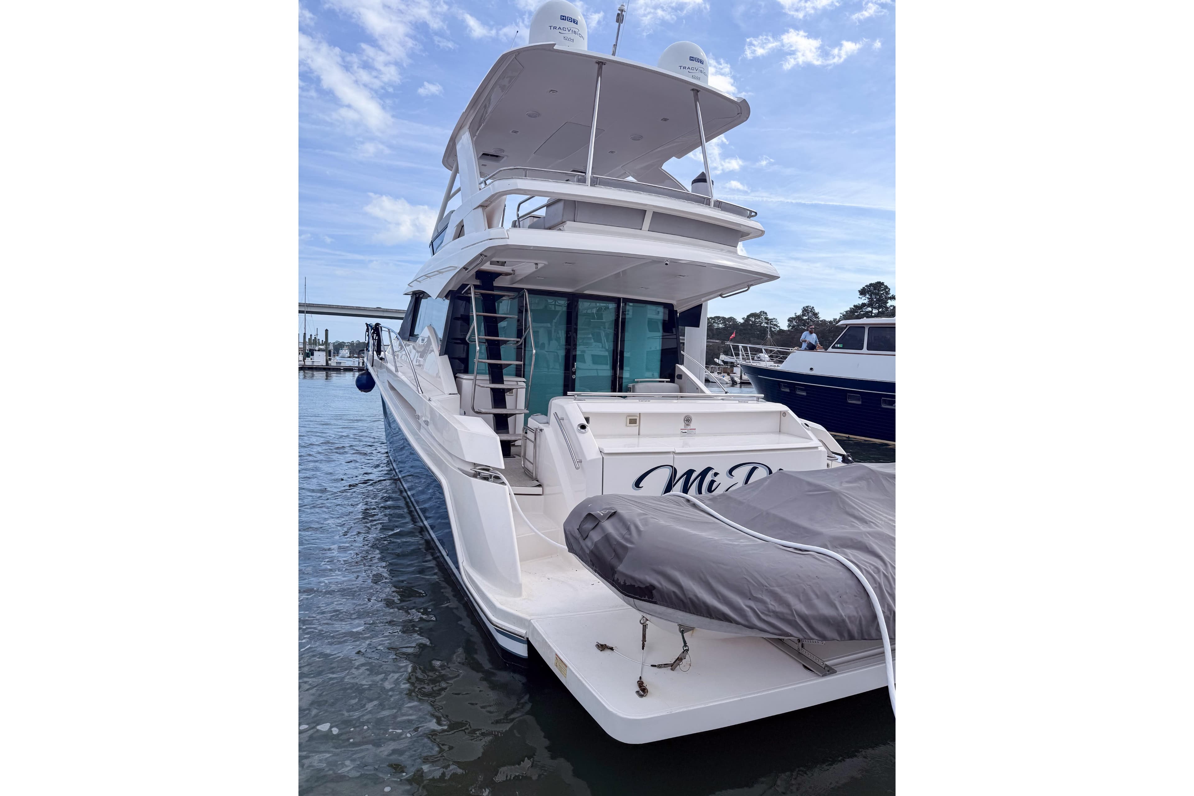 2019 Tiara Yachts F53 Flybridge docked, showcasing sleek design and spacious flybridge.