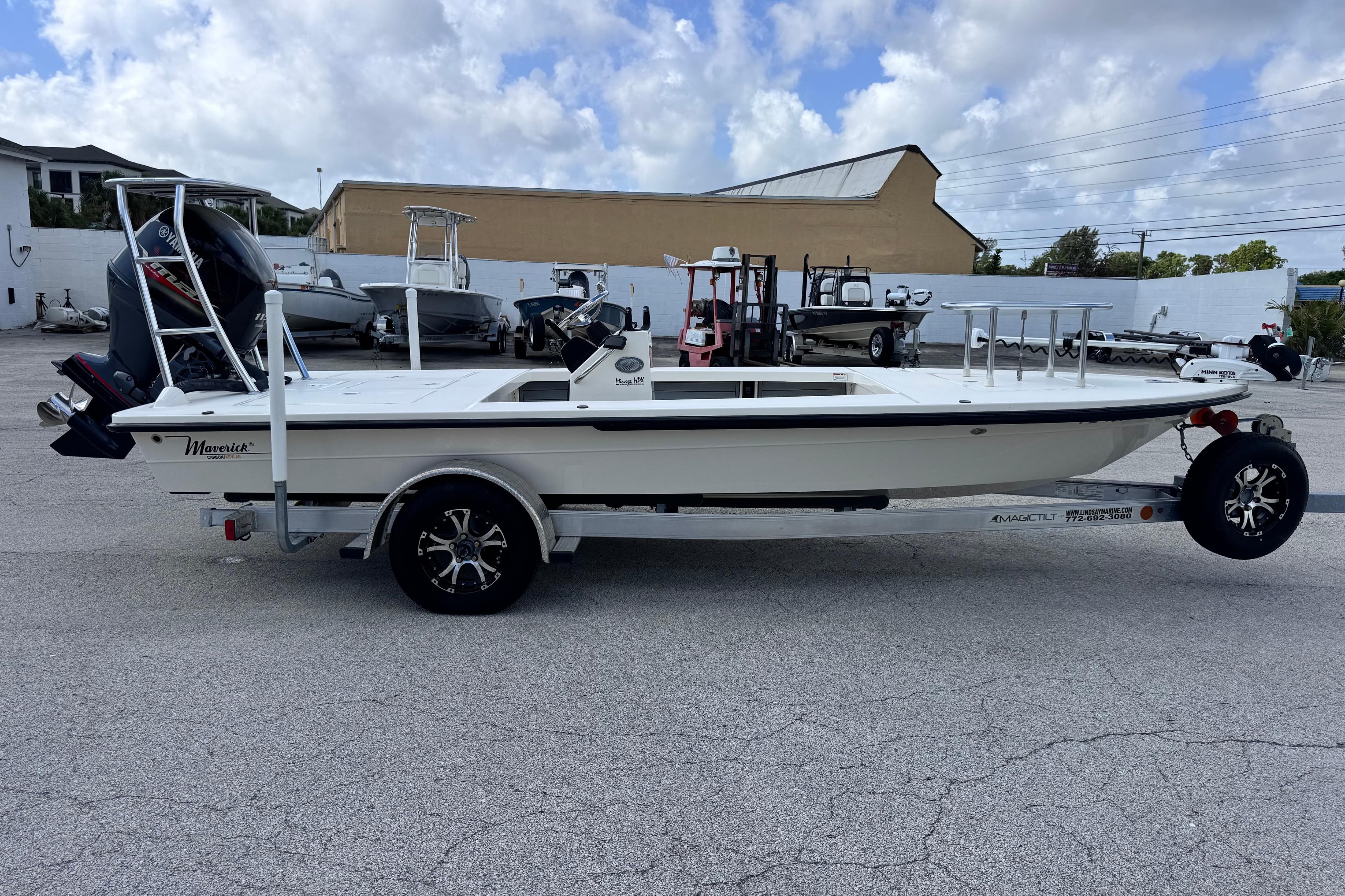 2022 Maverick 18 HPX-V boat on trailer, parked outdoors under a cloudy sky.