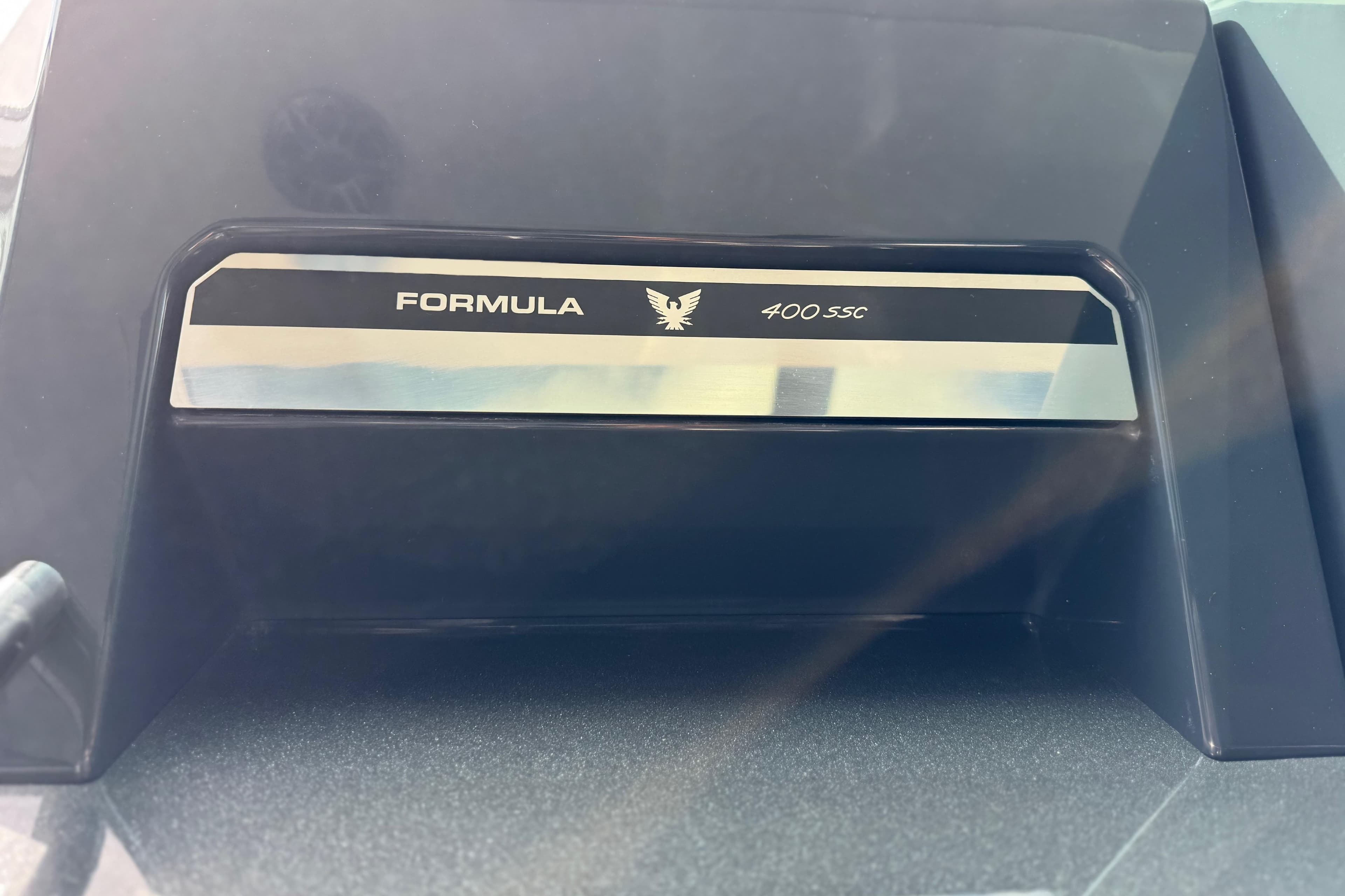 2023 Formula 400 Super Sport Crossover emblem on a sleek black surface.