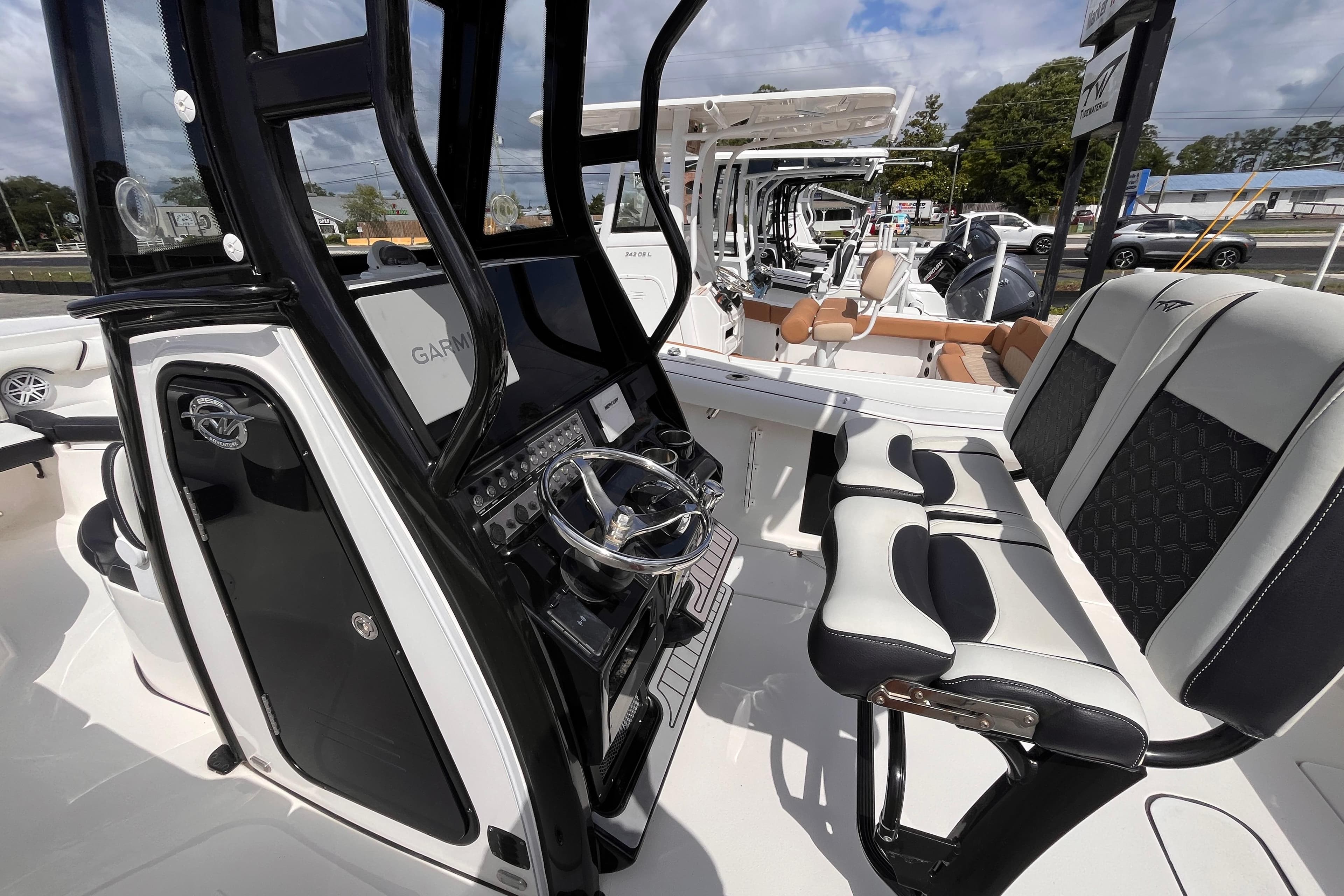 2022 Tidewater 256 CC Adventure boat interior with modern helm and seating.