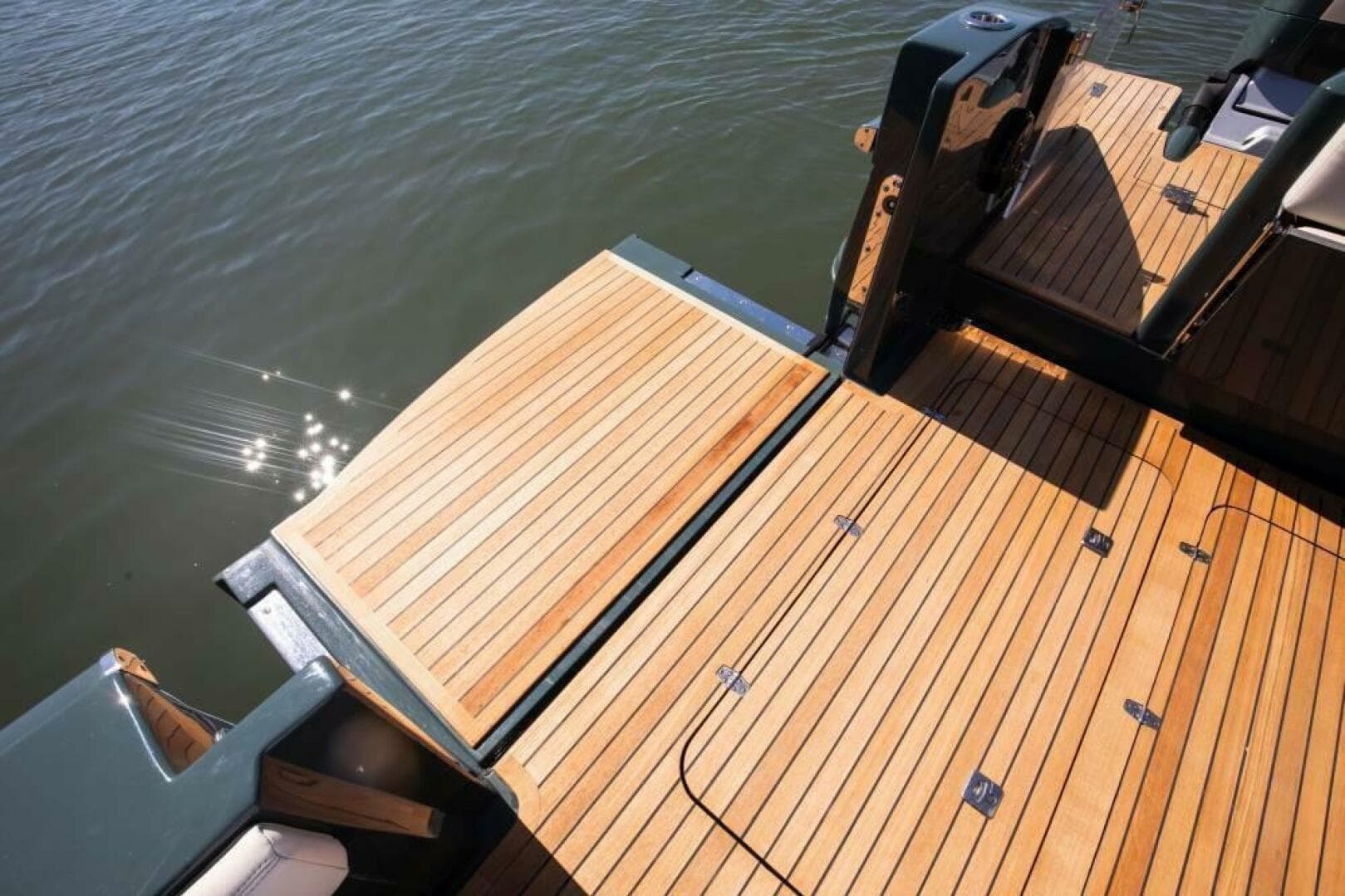 Luxury 2026 Buddy Davis Pininfarina boat deck with sleek wooden finish on water.