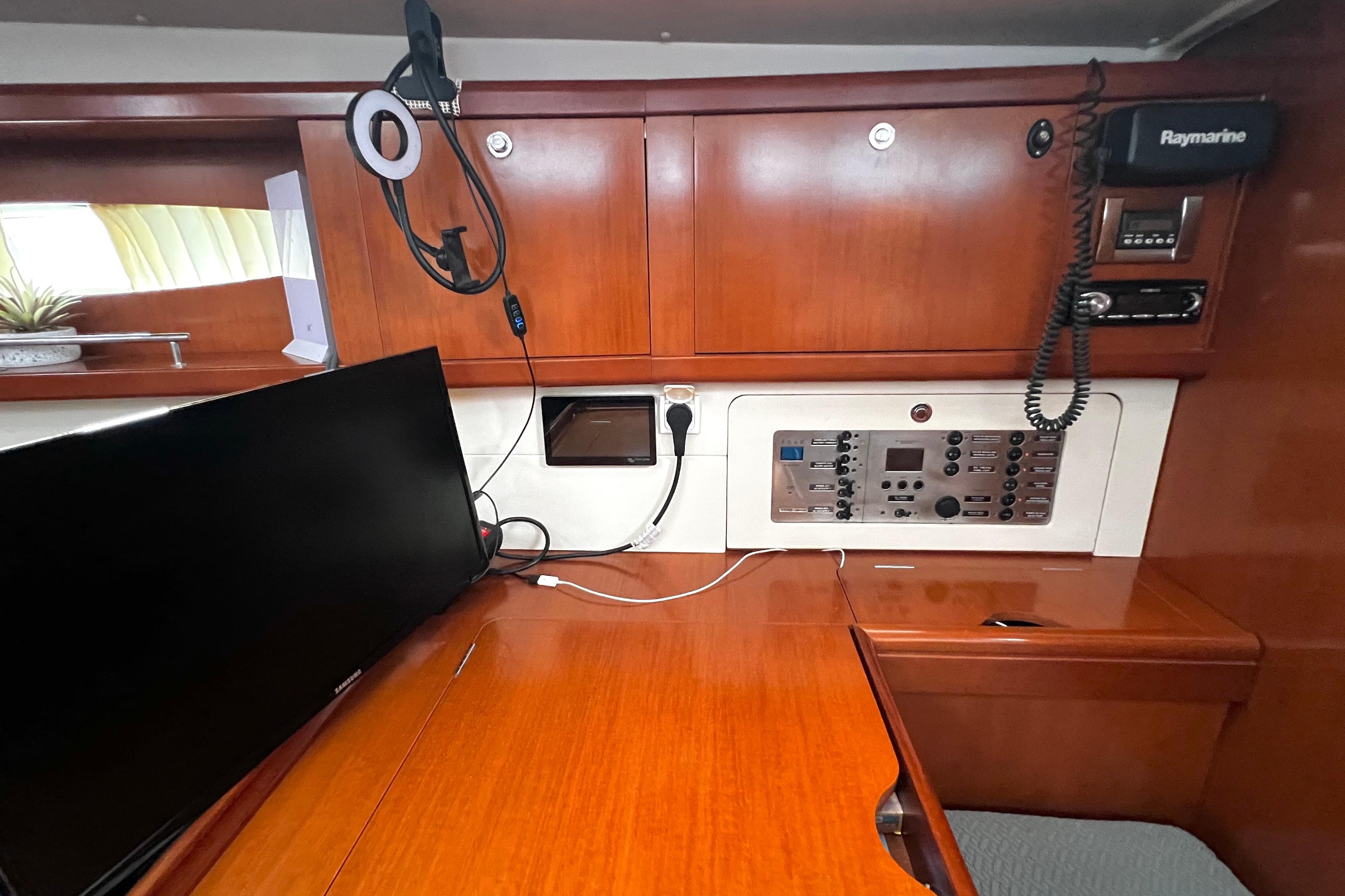Navigation station of 2006 Beneteau Oceanis 50 yacht with control panel and electronics.