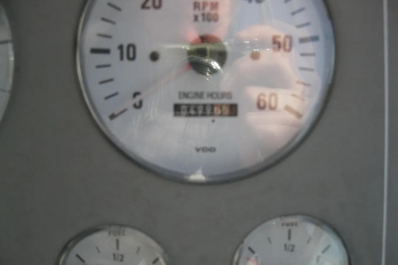 Close-up of 2000 Formula 31 Performance Cruiser engine hour gauge.