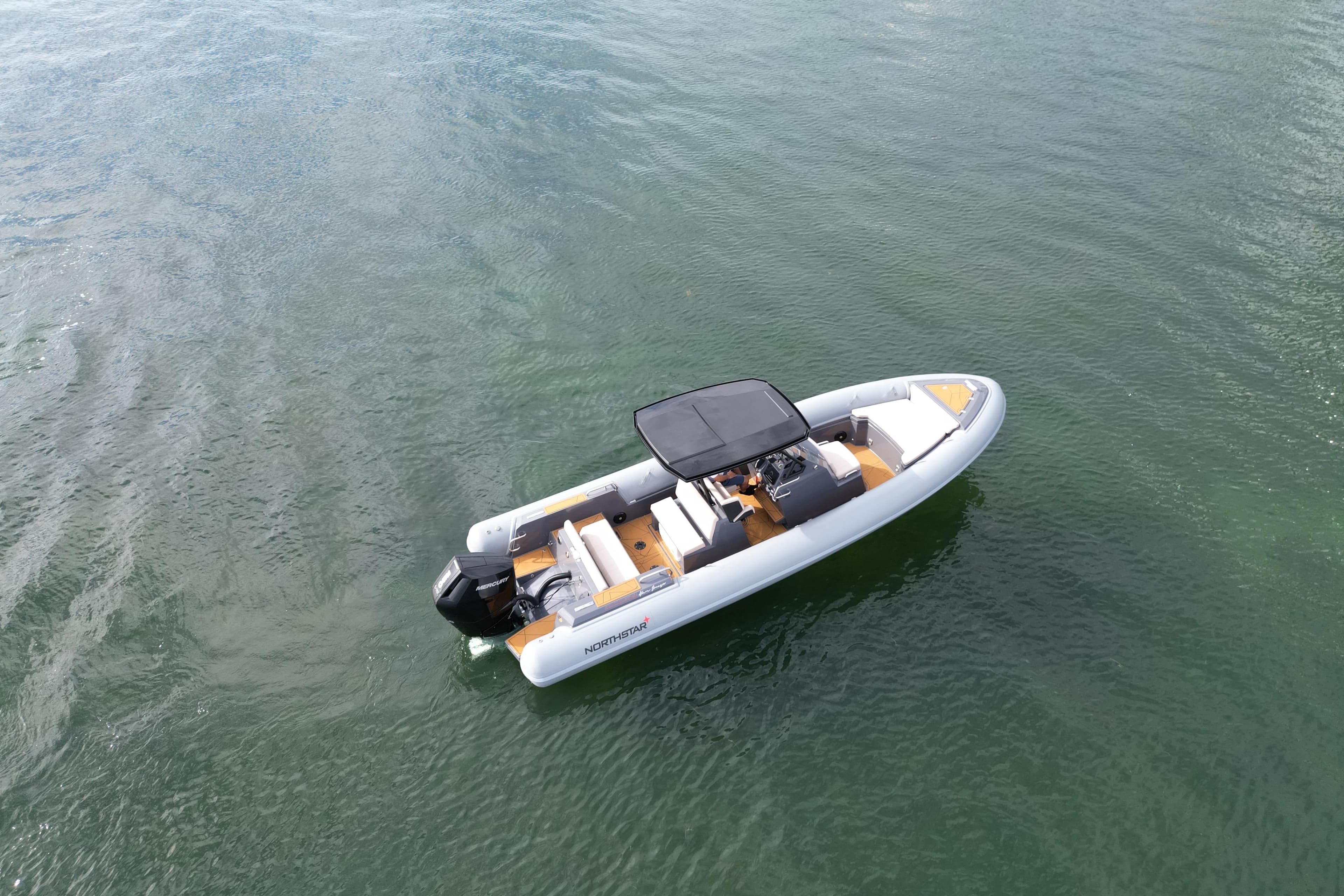 2026 Northstar Orion 8 boat on calm water, featuring sleek design and modern amenities.