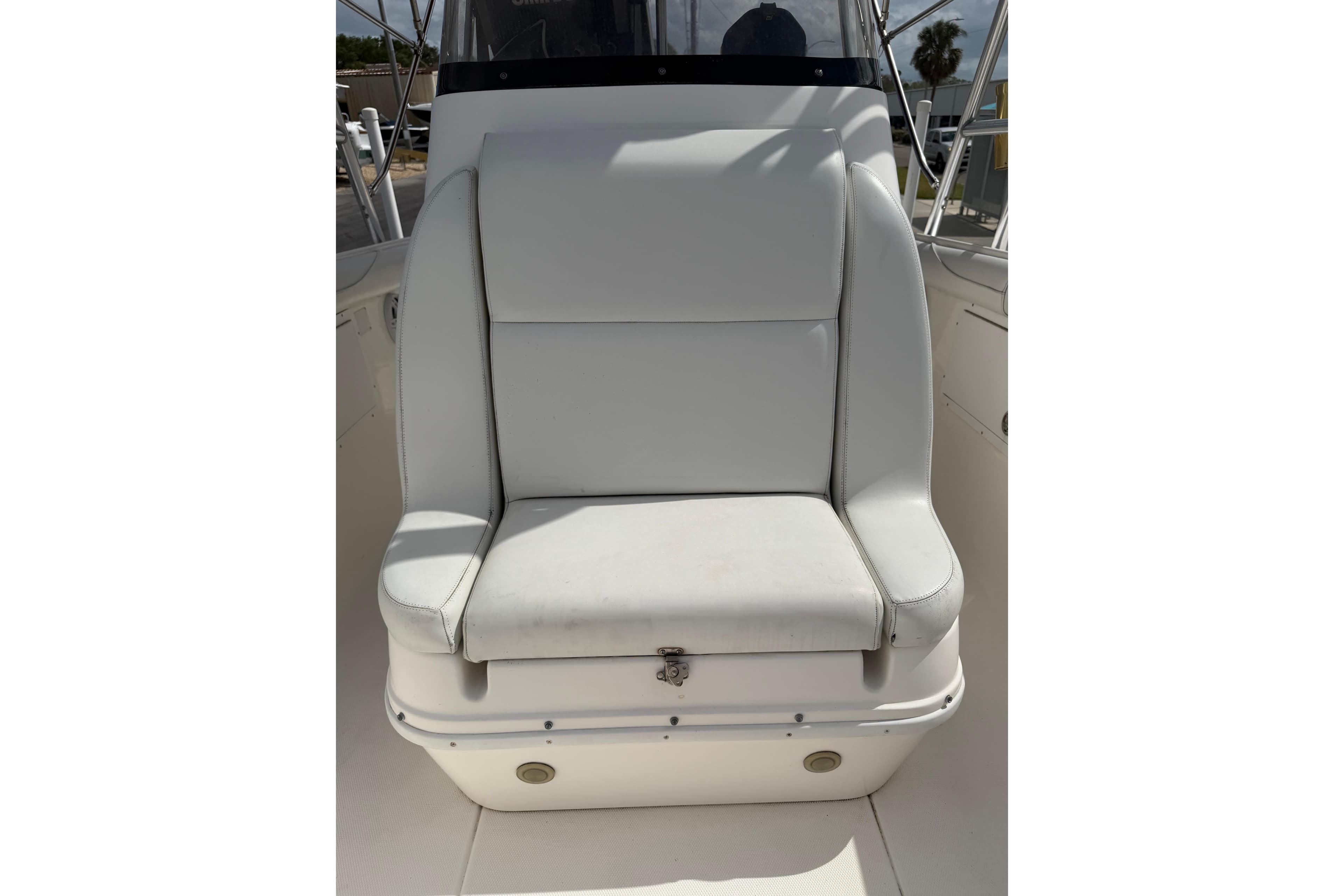 White seat on 1997 Wellcraft 302 Scarab Sport boat, featuring sleek design and comfortable cushioning.