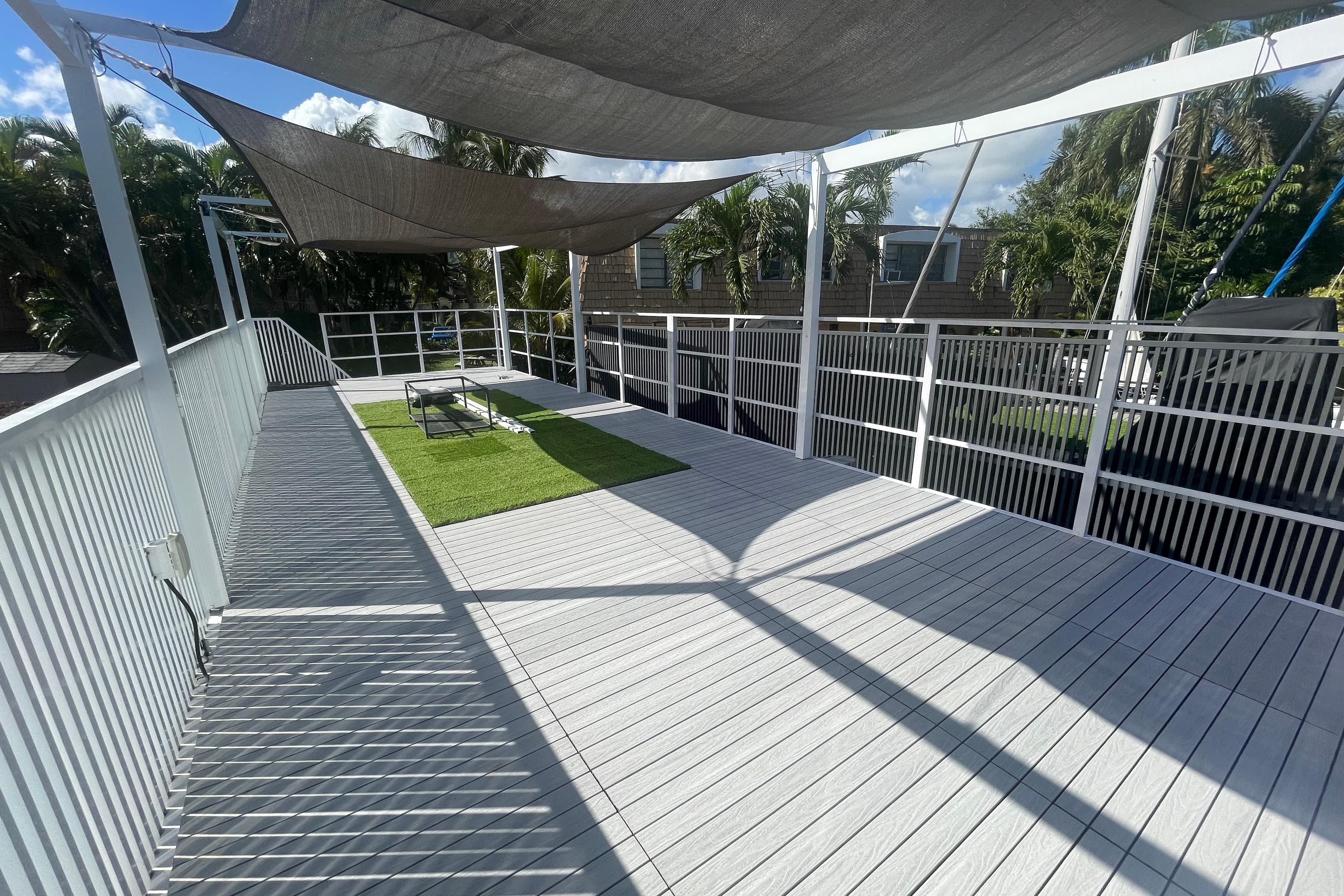 Modern Struktures MS400 deck with shade sails and green turf, 2023 model.