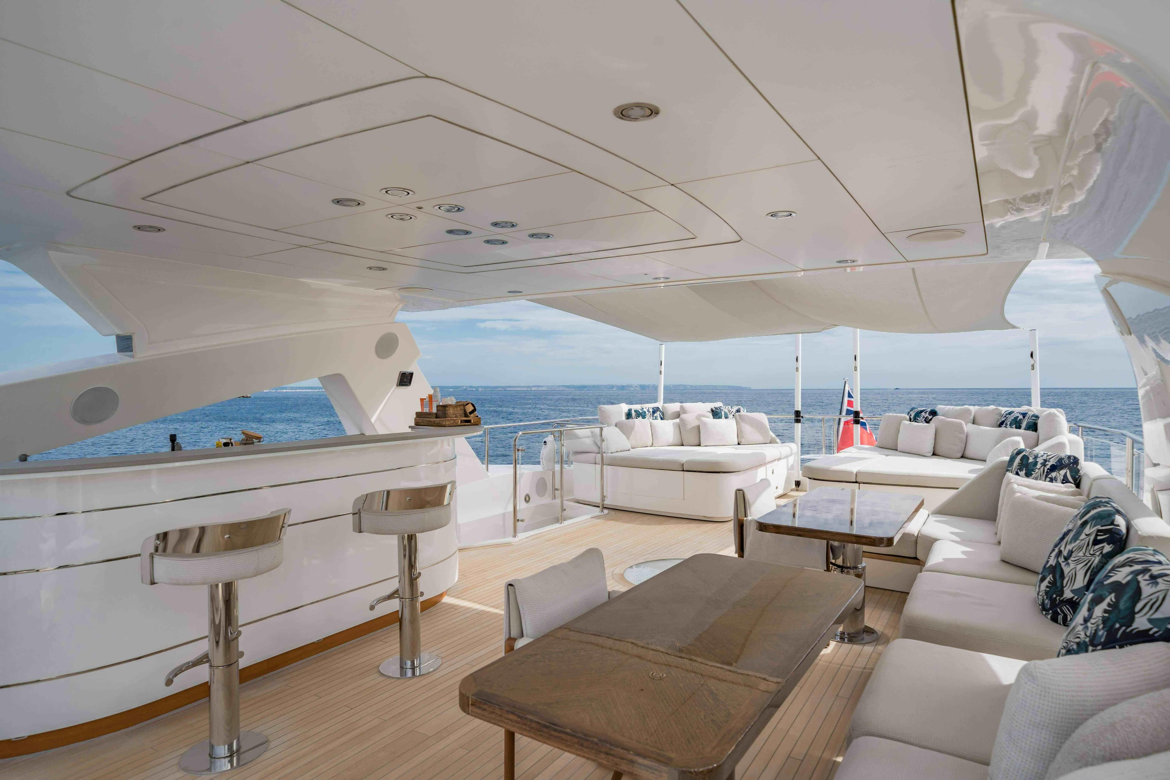 Luxurious Sunseeker 131 Yacht 2016 with elegant outdoor seating and ocean view.