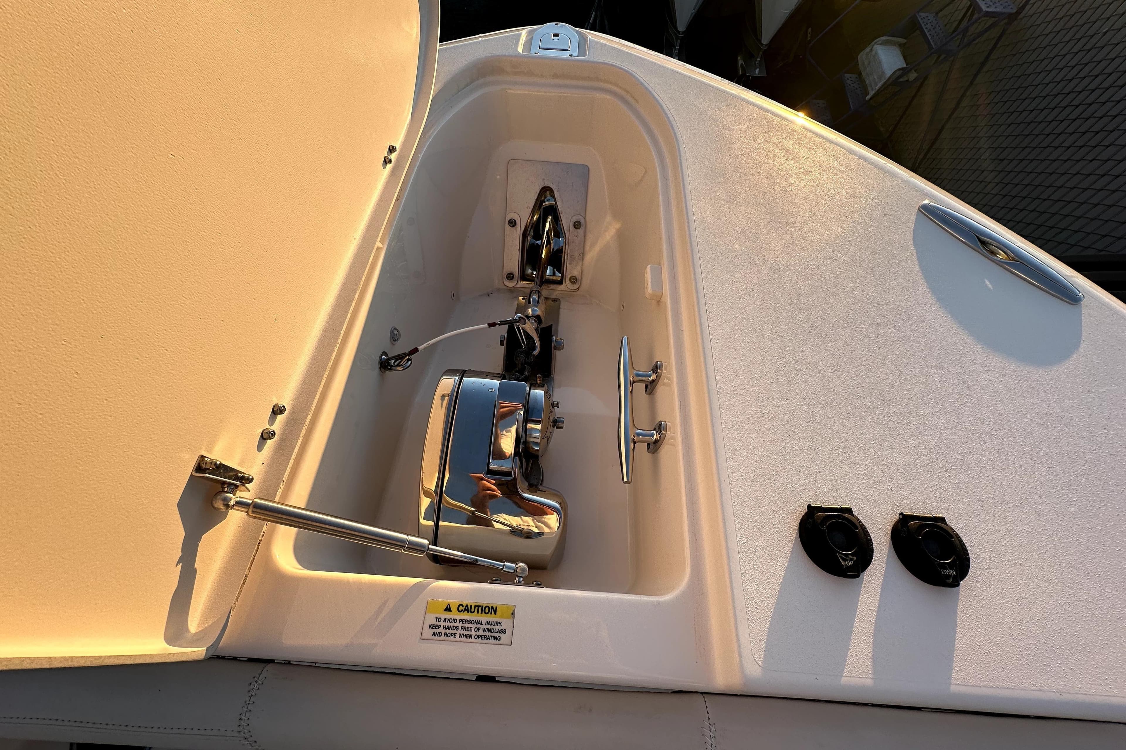 Anchor compartment of 2019 Grady-White Canyon 336 boat, featuring polished metal components.