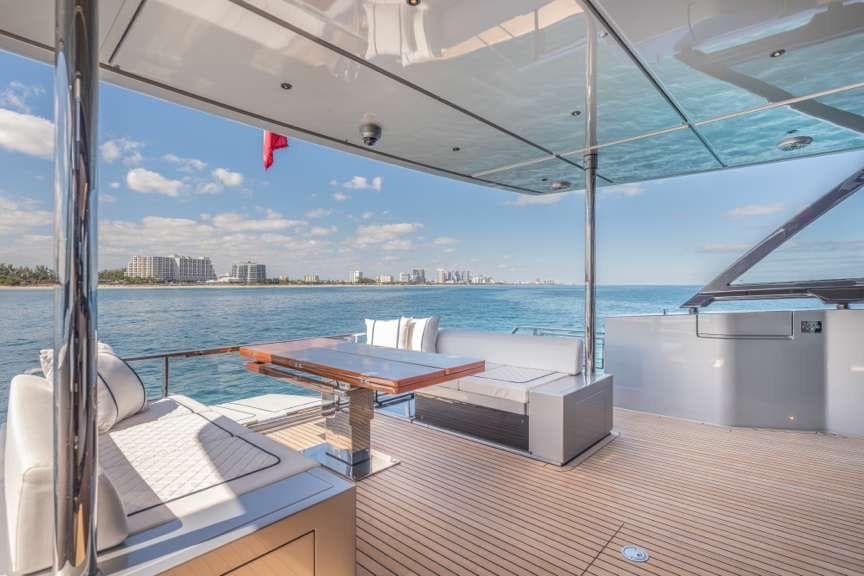 Luxurious 2026 Riva 82' Diva yacht deck with ocean view and elegant seating.