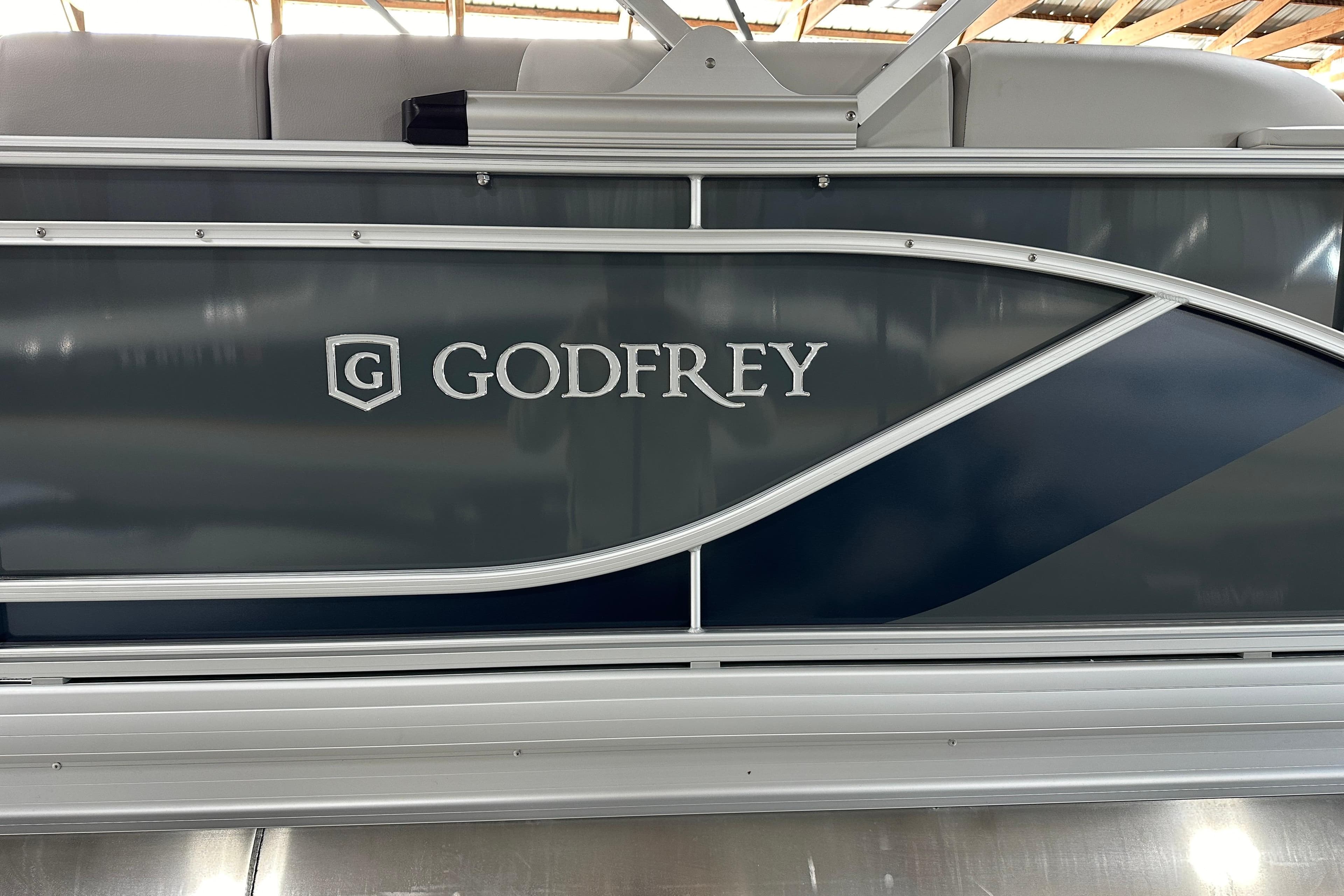 2026 Godfrey Sweetwater 2286 C pontoon boat side view with logo.