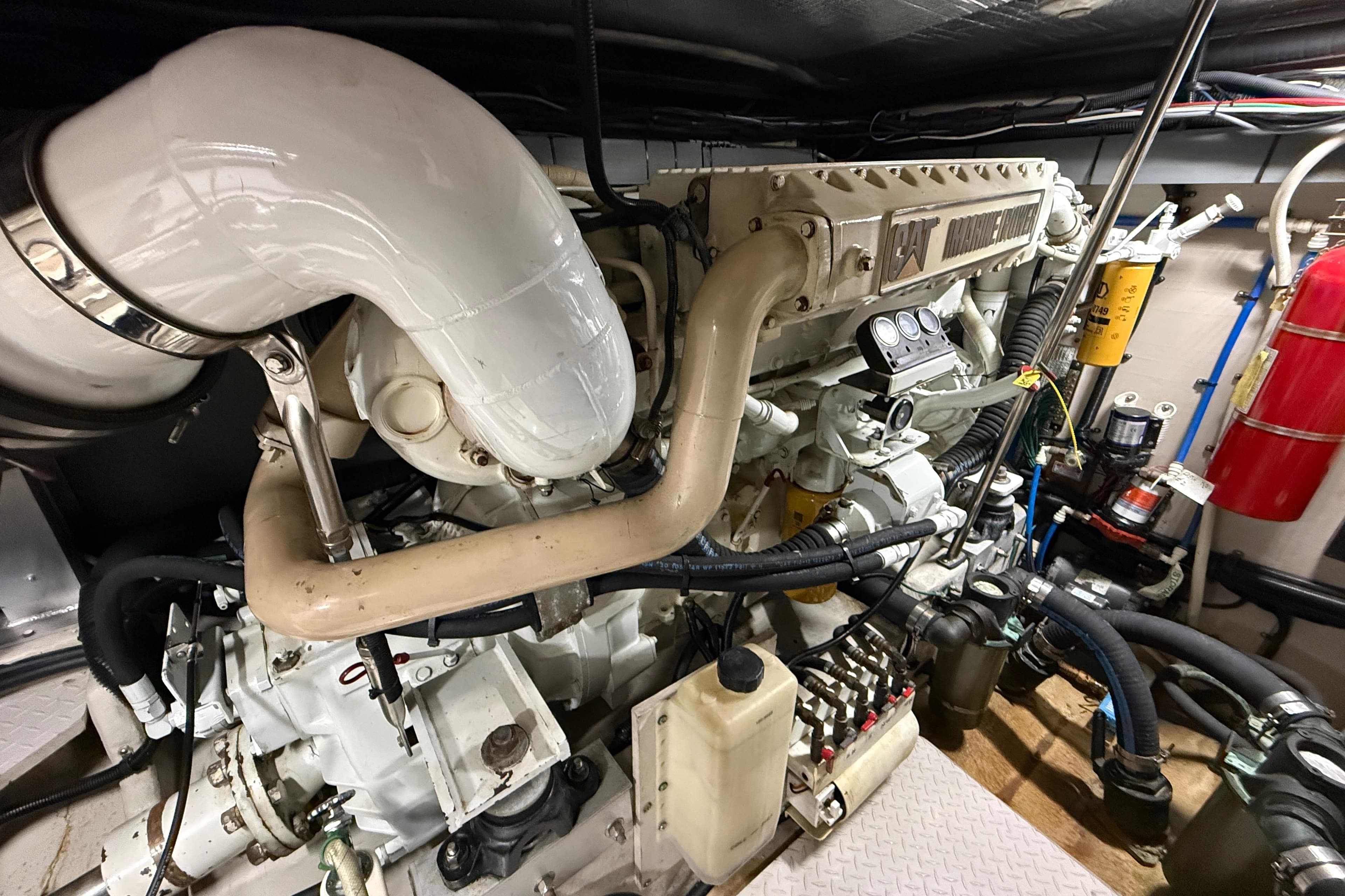 Engine room of a 2000 Sea Ray Sundancer 540 with visible CAT marine engine.