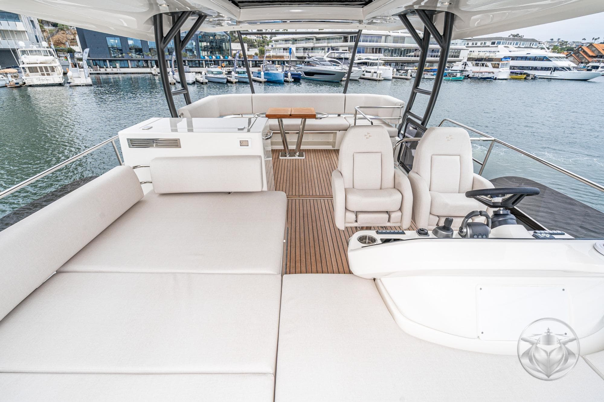 Luxurious Prestige F5.7 yacht interior, 2026 model, featuring spacious seating and modern helm.