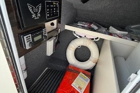 Interior of a 2015 Formula 310 Bowrider boat with safety equipment and control panel.