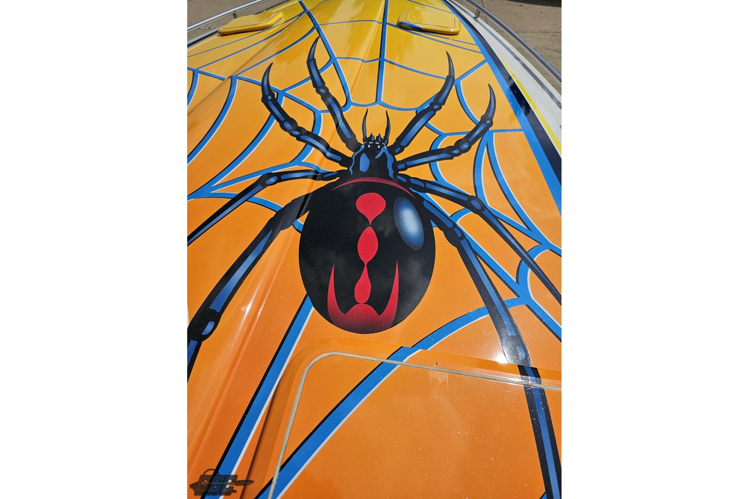 2007 Formula 353 FASTech boat with vibrant spider and web design on the hull.