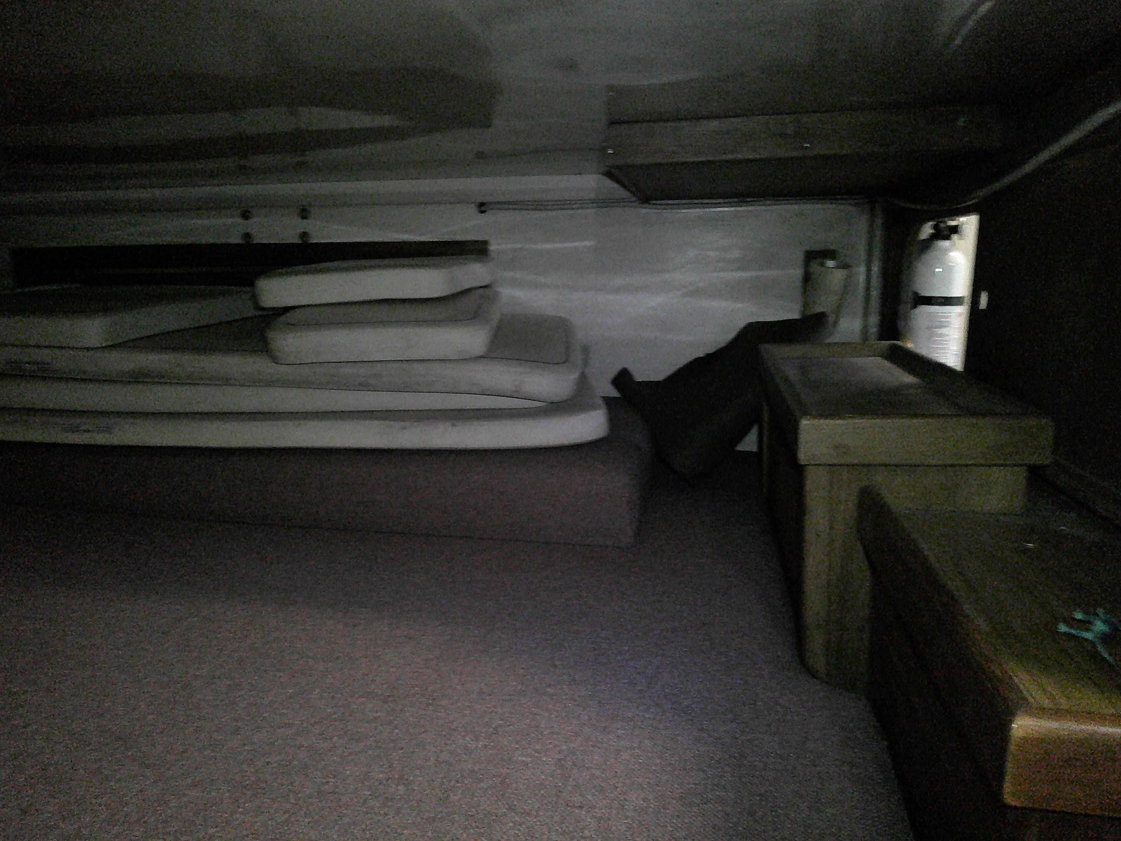 Interior cabin of a 1984 Catalina 36' sloop with cushions and storage.
