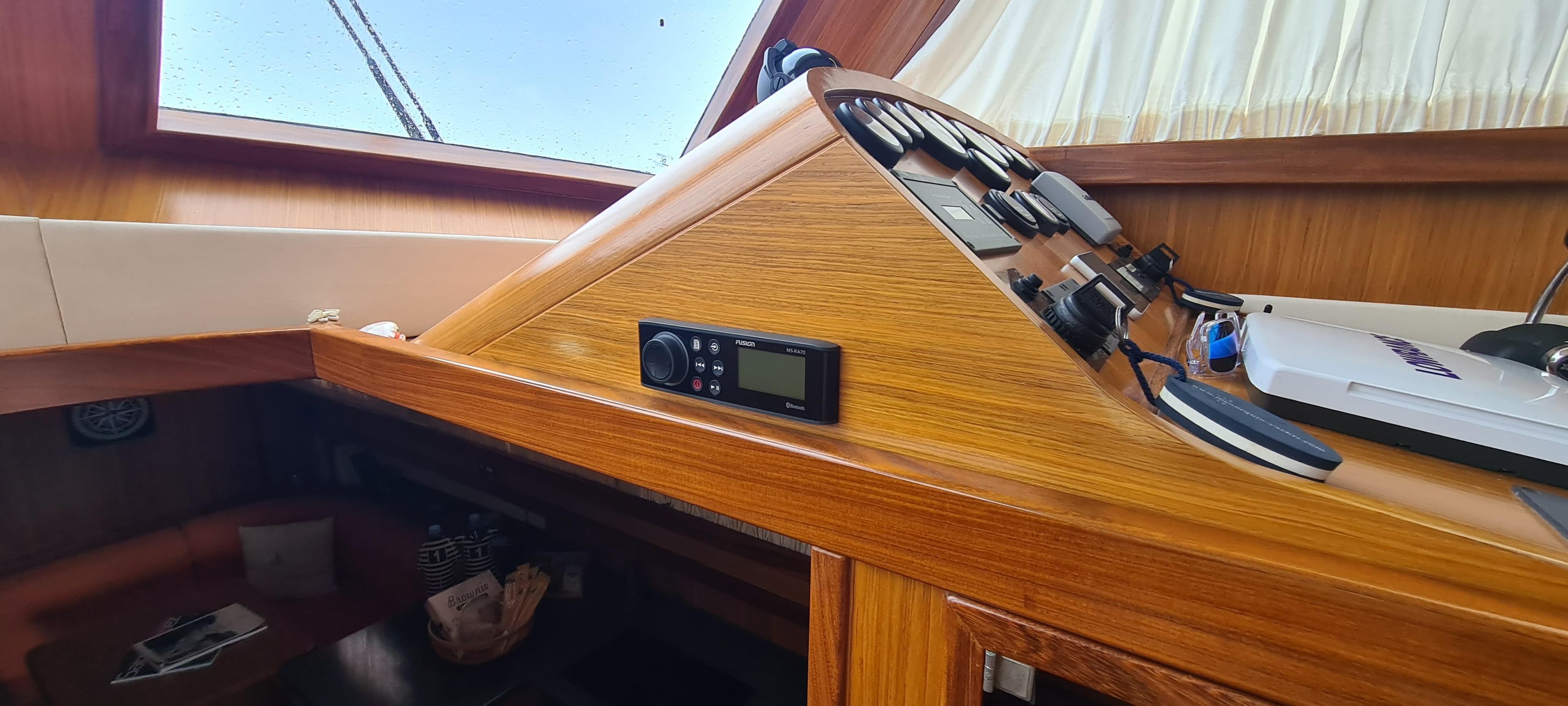 Interior view of 2007 Menorquin 145 boat helm with wooden dashboard and controls.