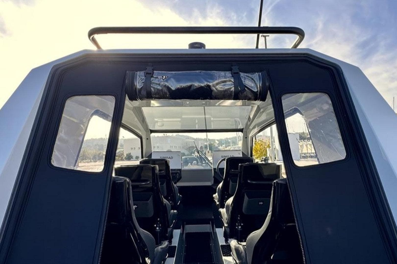 Interior view of 2023 Goldfish X10 EXPLORER boat with seating and navigation equipment.