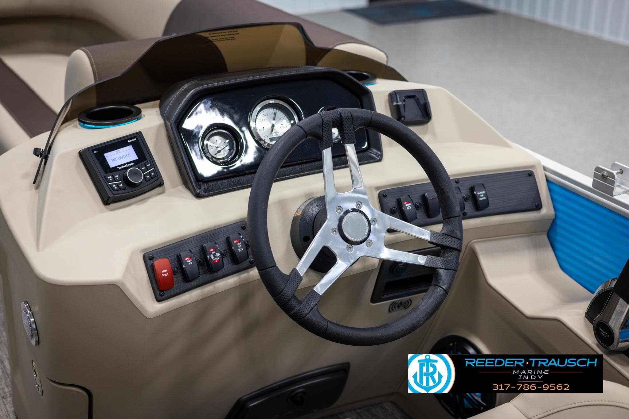 Interior view of Bennington 20 SL 2025 helm with modern instruments.