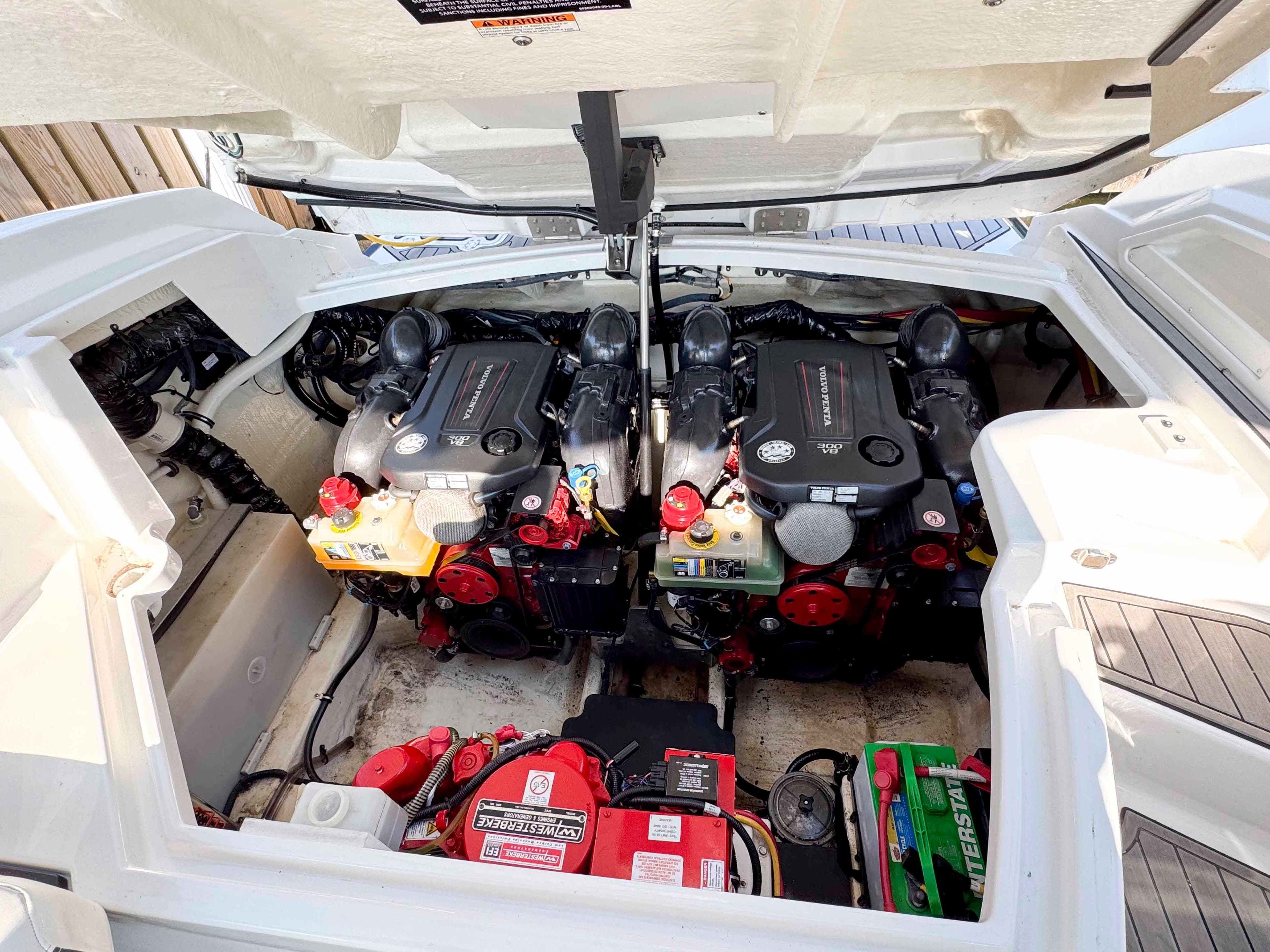 Engine compartment of a 2017 Monterey 328 Super Sport boat, featuring dual engines.