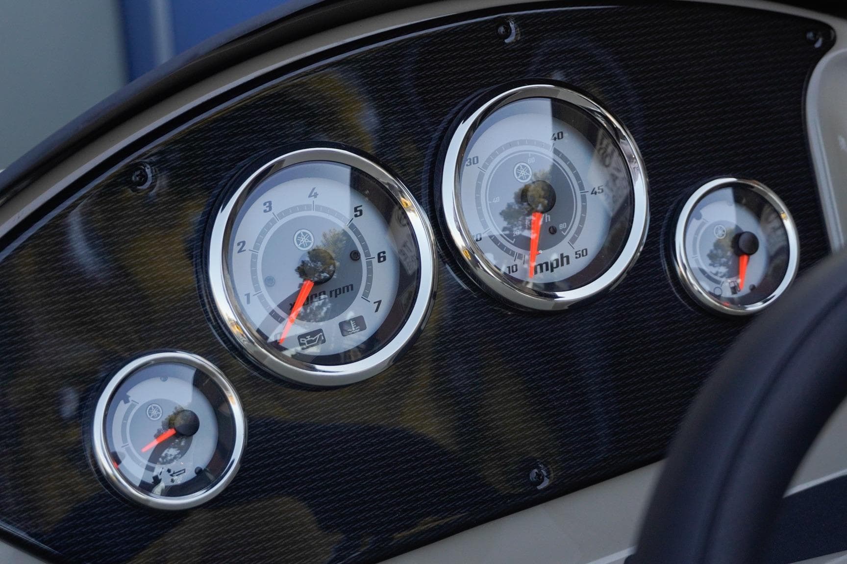 Dashboard gauges of 2026 SunCatcher Select 20F boat, featuring speedometer and tachometer.
