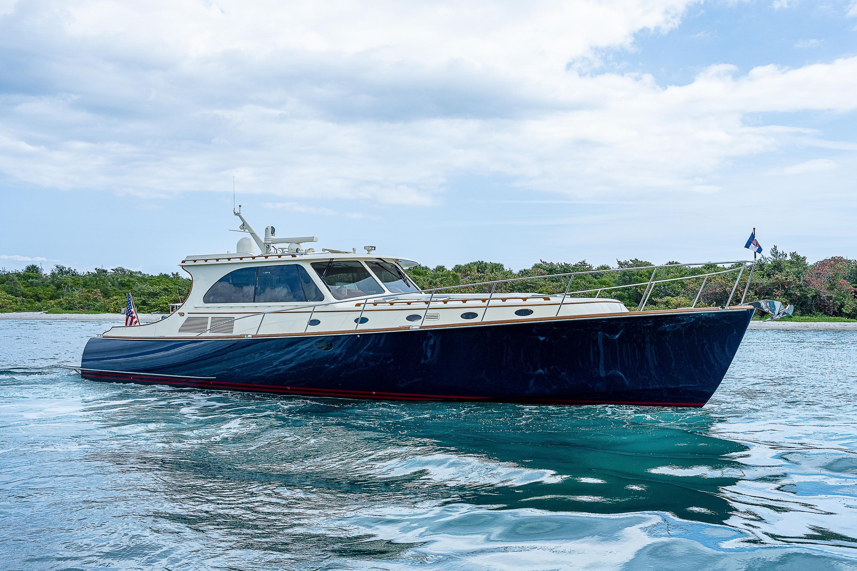 2018 Hinckley Talaria 55 MKII MY yacht cruising on calm waters.