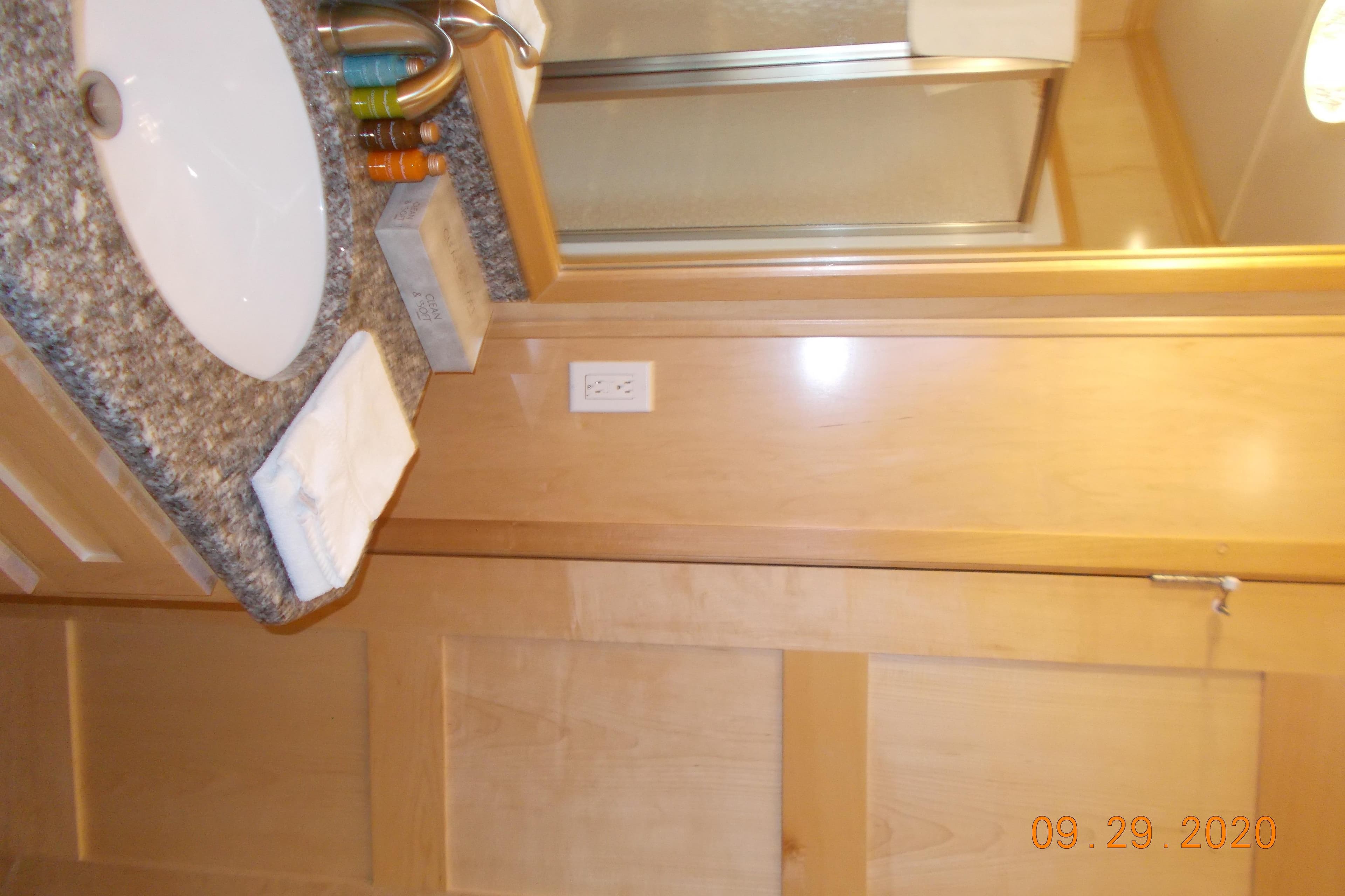 Modern bathroom in 2020 Sumerset Antelope Escape Share #4 with granite countertop and shower.
